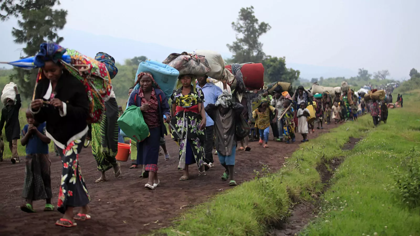 Families flee renewed fighting between the Congolese army and M23 rebels near the eastern city of Goma in July, 2012.
