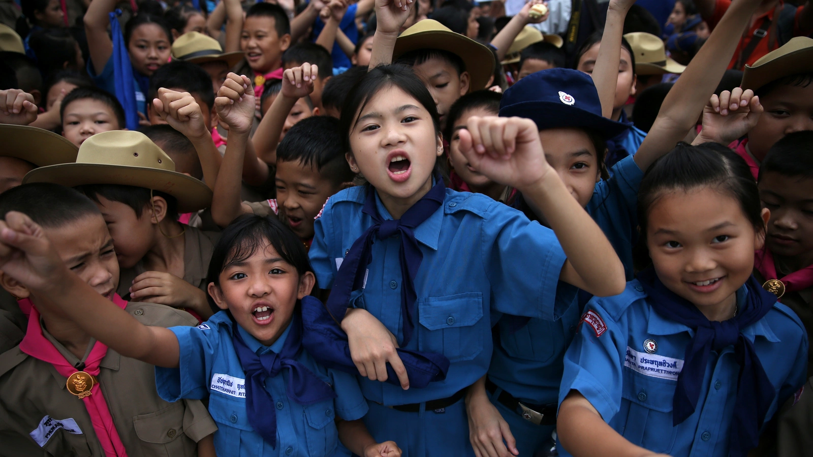 Students celebrate in front of Chiang Rai Prachanukroh Hospital after twelve soccer players and their coach were rescued from Tham Luang Cave in Thailand.