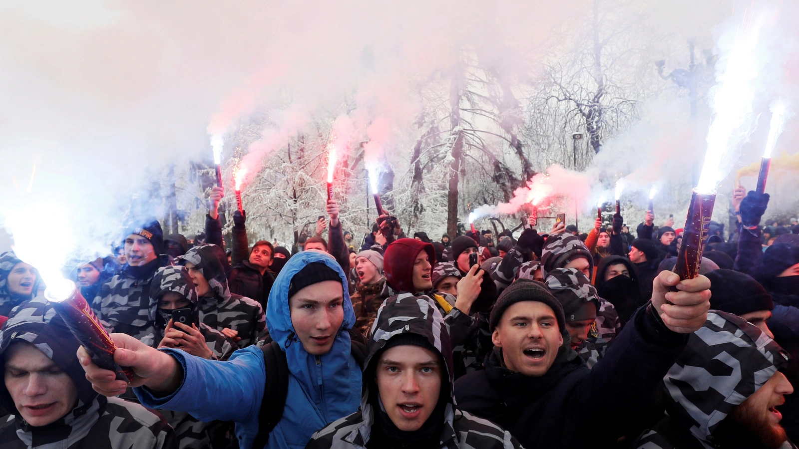 Activists burn flares during a rally in Kiev to support the Ukrainian navy after Russia seized two Ukrainian armored artillery vessels and a tug boat in the Black Sea.