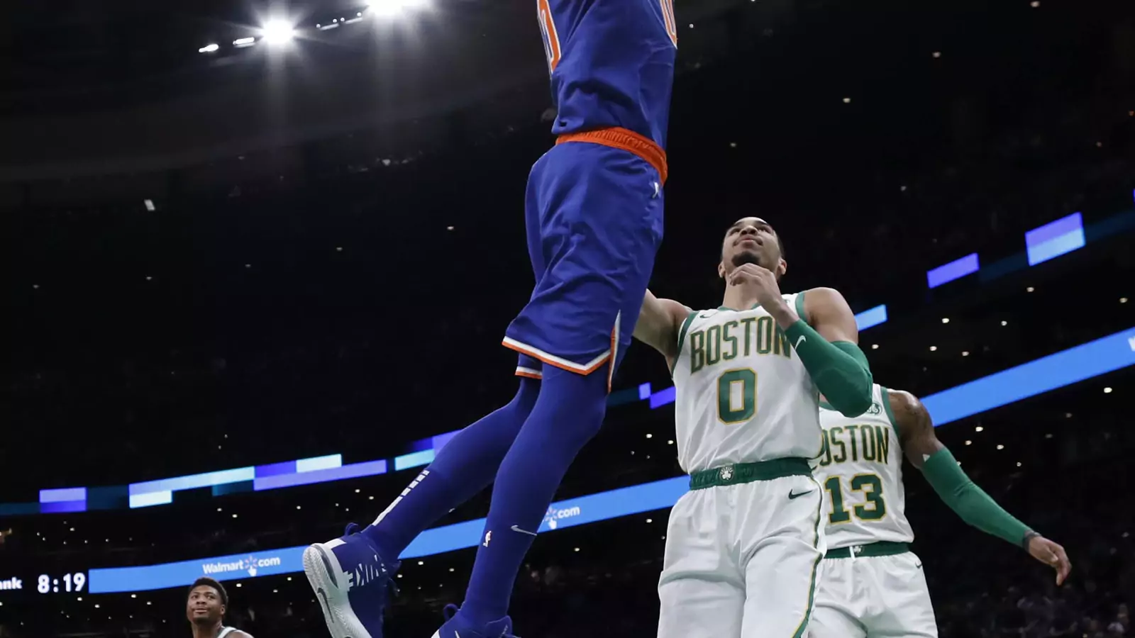 New York Knicks center Enes Kanter (00) dunks the ball over Boston Celtics forward Jayson Tatum (0) during the first half at TD Garden