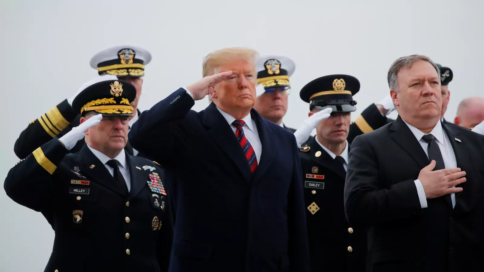 Chief of Staff of the U.S. Army Mark Milley, President Donald Trump, Sgt. Maj. of the Army Daniel Dailey and Secretary of State Mike Pompeo salute as a military honor guard carries the casket of Scott Wirtz