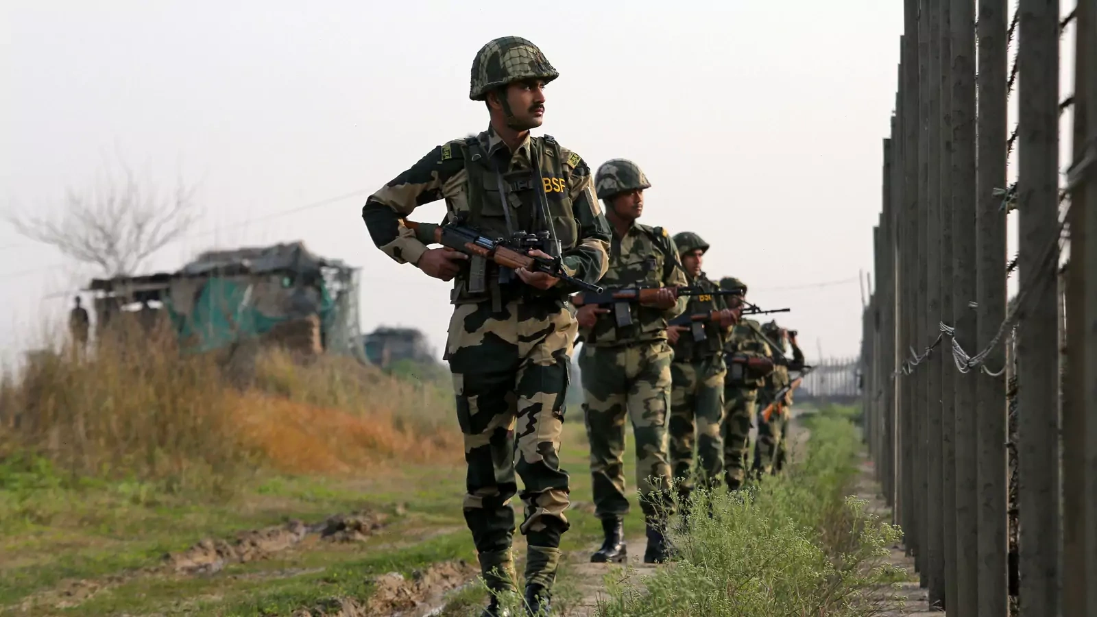 India's Border Security Force (BSF) soldiers patrol along the fenced border with Pakistan in Ranbir Singh Pura sector near Jammu February 26, 2019.