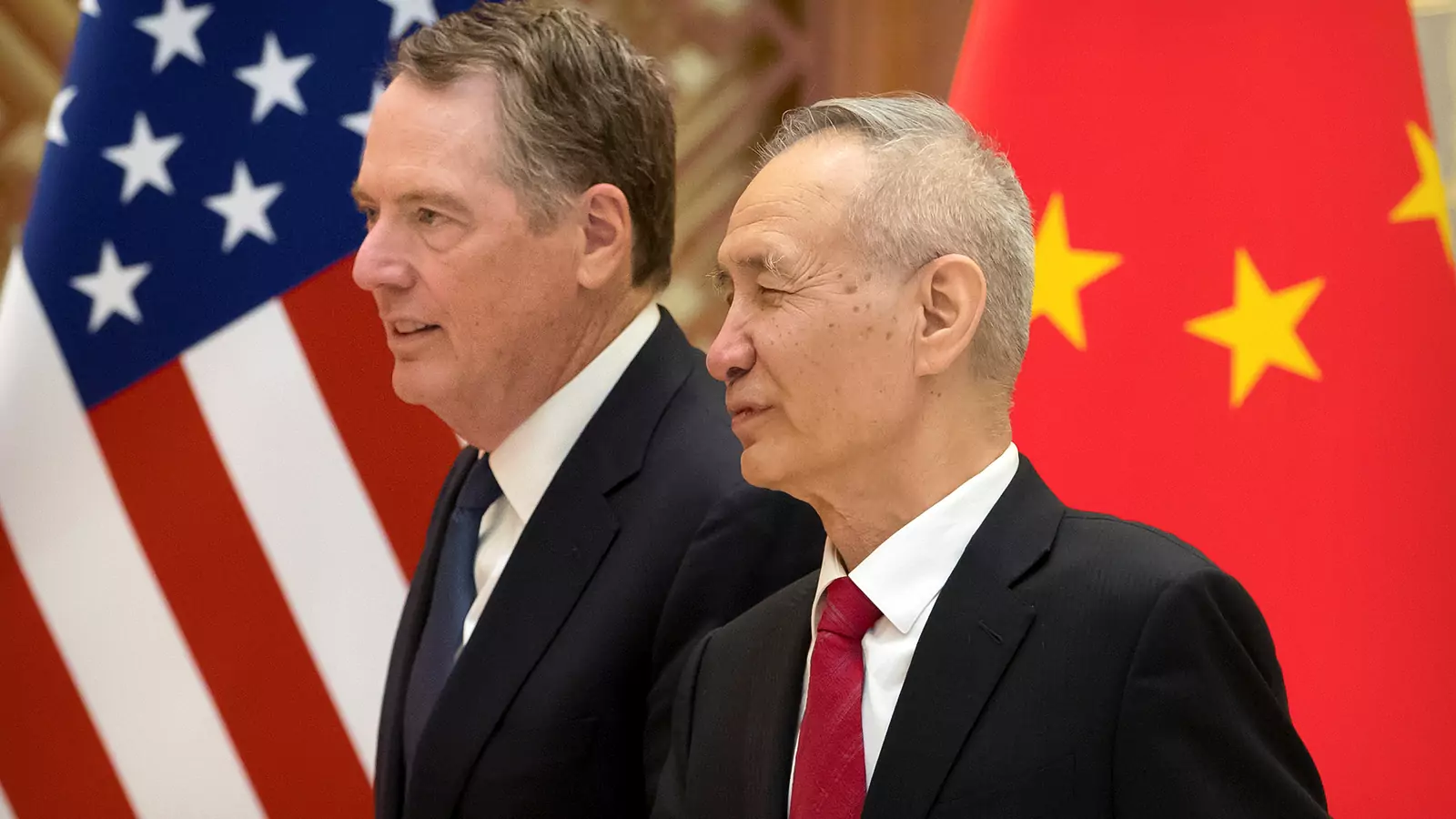U.S. Trade Representative Robert Lighthizer, left, and Chinese Vice Premier Liu He arrive for a group photo at the Diaoyutai State Guesthouse in Beijing, China February 15, 2019.