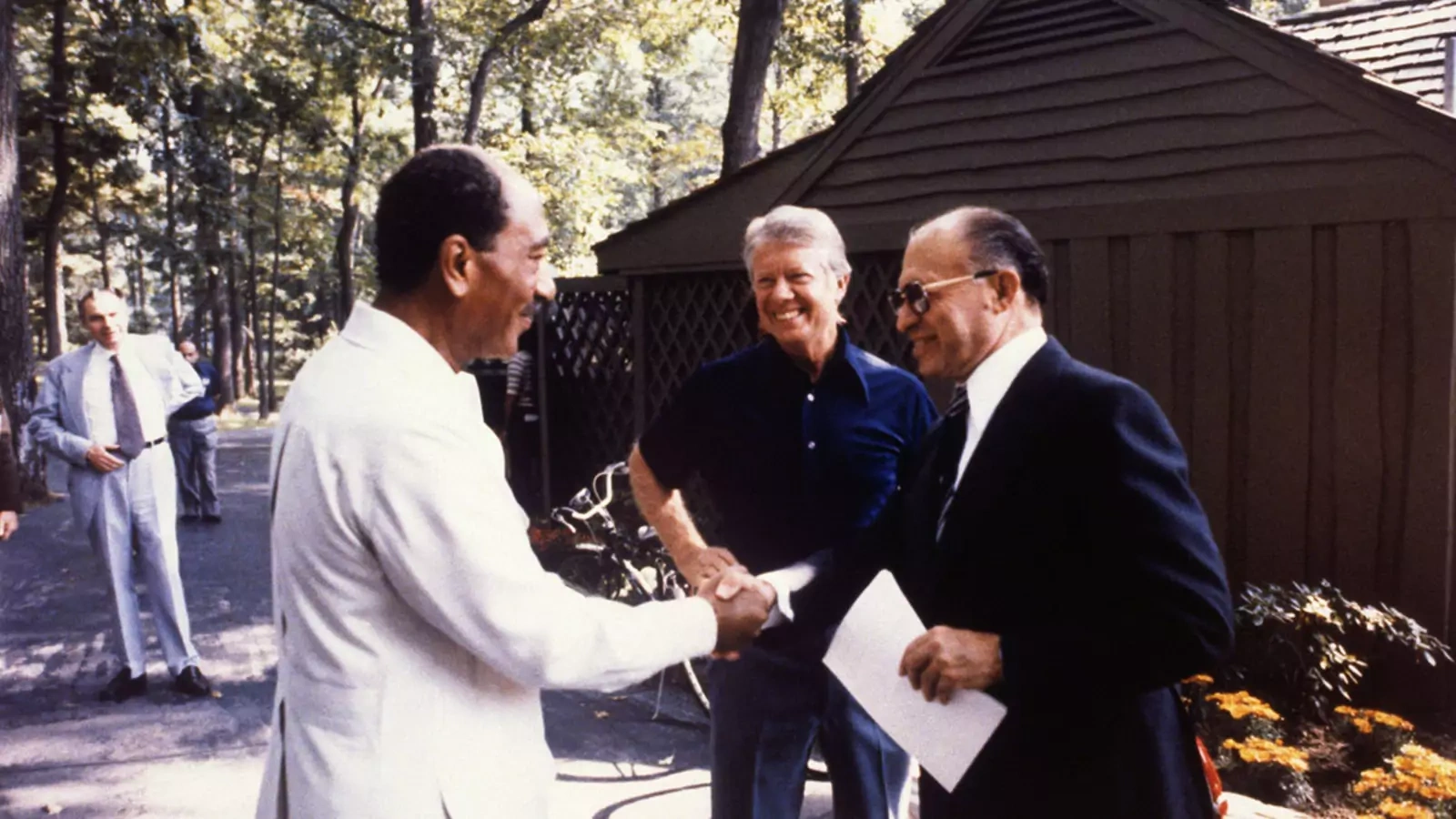 Israeli Prime Minister Menachem Begin shakes hands with Egyptian President Anwar Sadat at the start of a trilateral meeting with U.S. President Jimmy Carter in 1978.