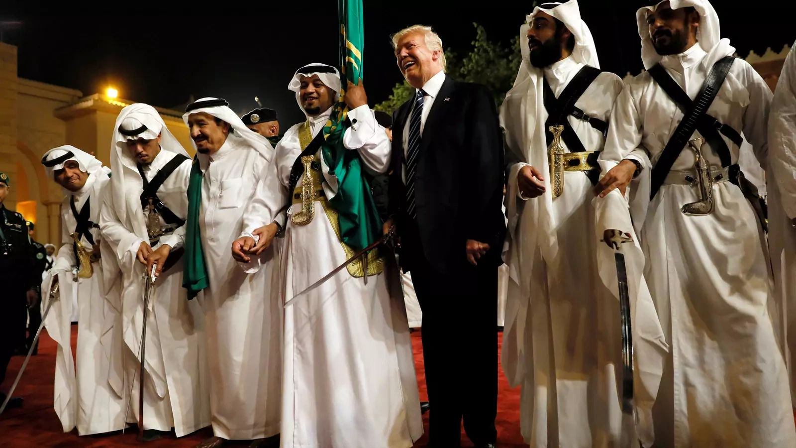 U.S. President Donald Trump dances with a sword as he arrives to a welcome ceremony at Al Murabba Palace in Riyadh, Saudi Arabia May 20, 2017.
