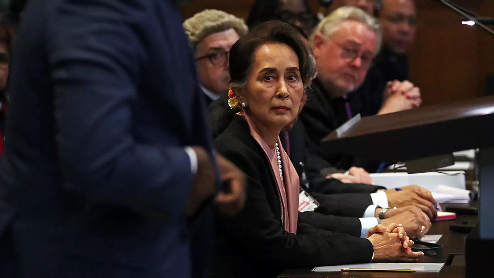 Myanmar leader Aung San Suu Kyi listens as Gambian Justice Minister Abubacarr Tambadou speaks at a hearing at the International Court of Justice in The Hague, Netherlands.