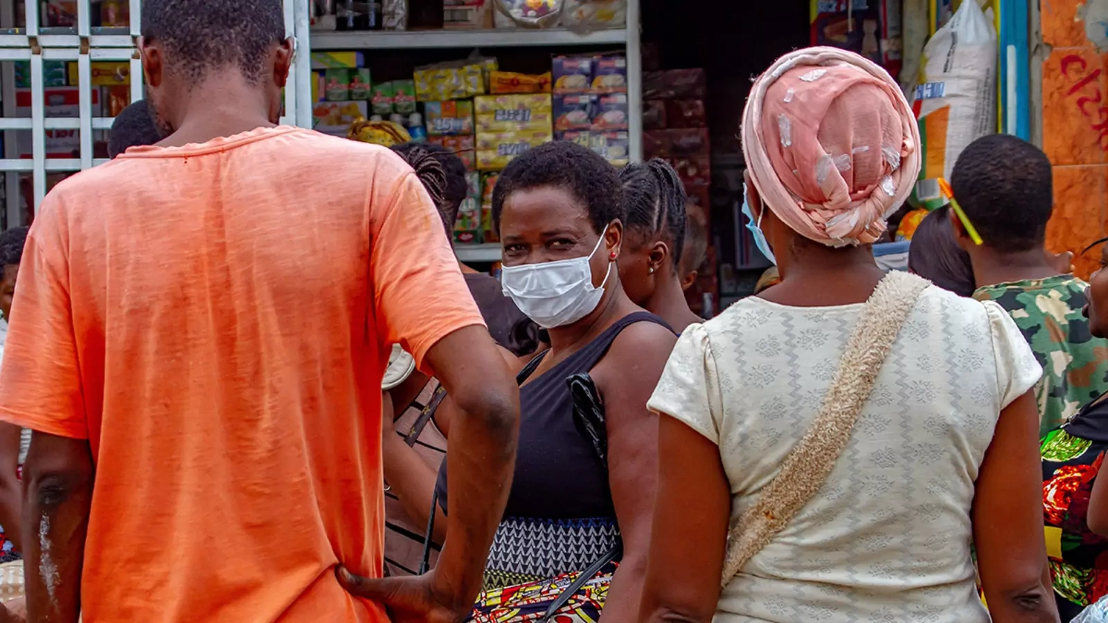 A food vendor wears a mask in Luanda, Angola, where severe restrictions have been implemented to help stop the spread of COVID-19.