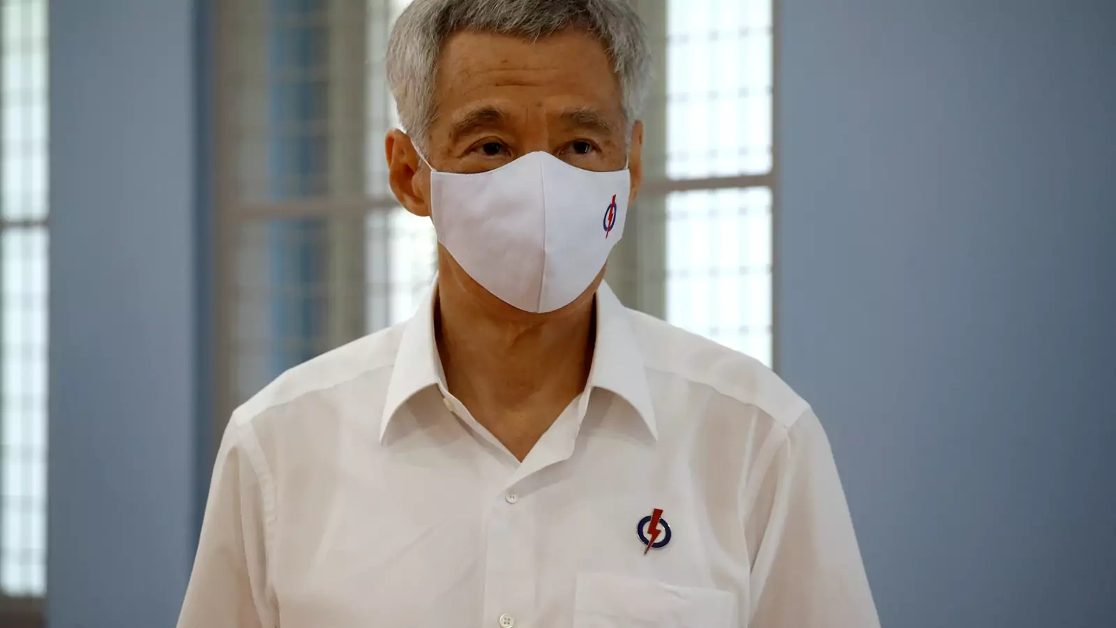 Singapore's Prime Minister Lee Hsien Loong of the ruling People's Action Party, wearing a face mask, prepares to give a speech at a nomination center ahead of the general election in Singapore on June 30, 2020.