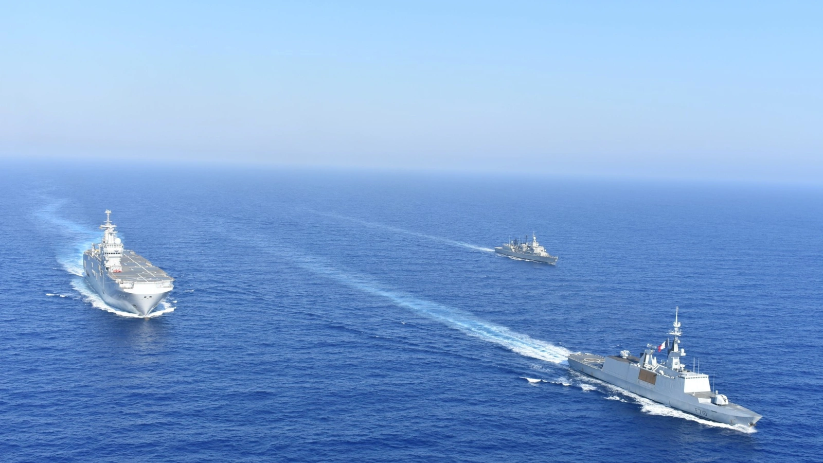 Greek and French vessels sail in formation during a joint military exercise in Mediterranean Sea.