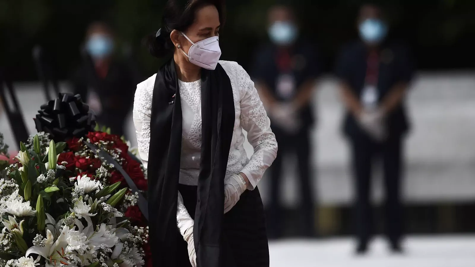 Myanmar State Counsellor and Foreign Minister Aung San Suu Kyi leaves after paying her respects to her late father during a ceremony to mark the 73rd anniversary of Martyrs' Day in Yangon on July 19, 2020.