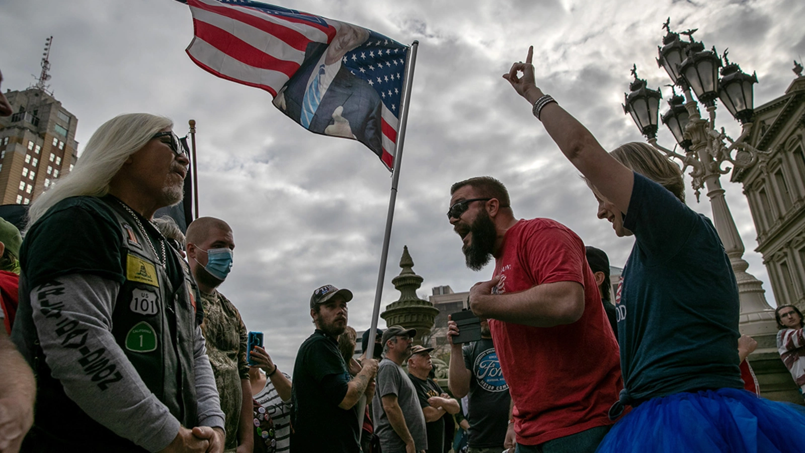 Pro-Trump (R) and anti-Trump demonstrators argue at the Michigan state capitol on November 08, 2020 in Lansing, Michigan.