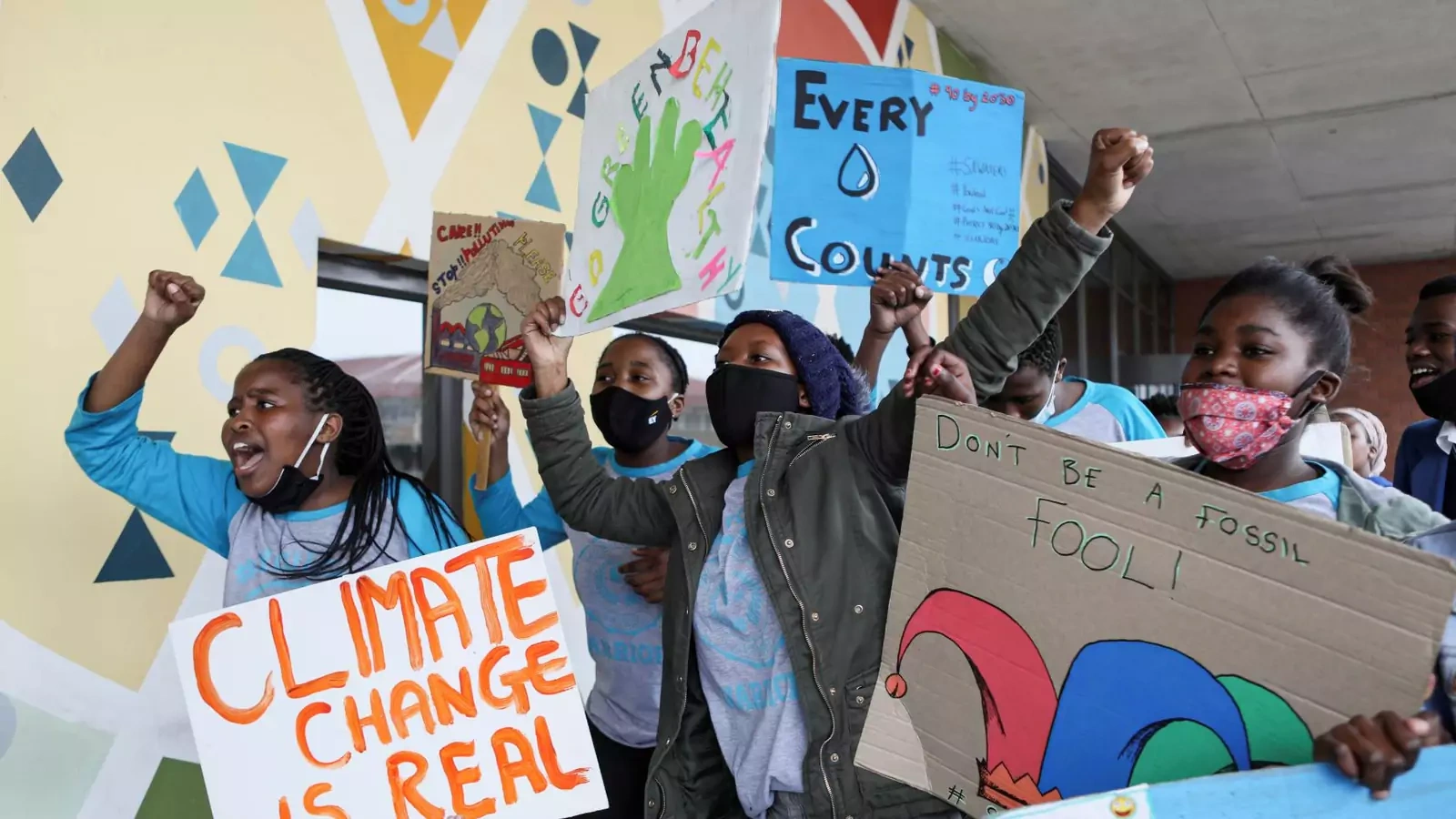 Young activists gesture as they take part in a demonstration during a global day of action on climate change near Cape Town, South Africa on September 25, 2020. 