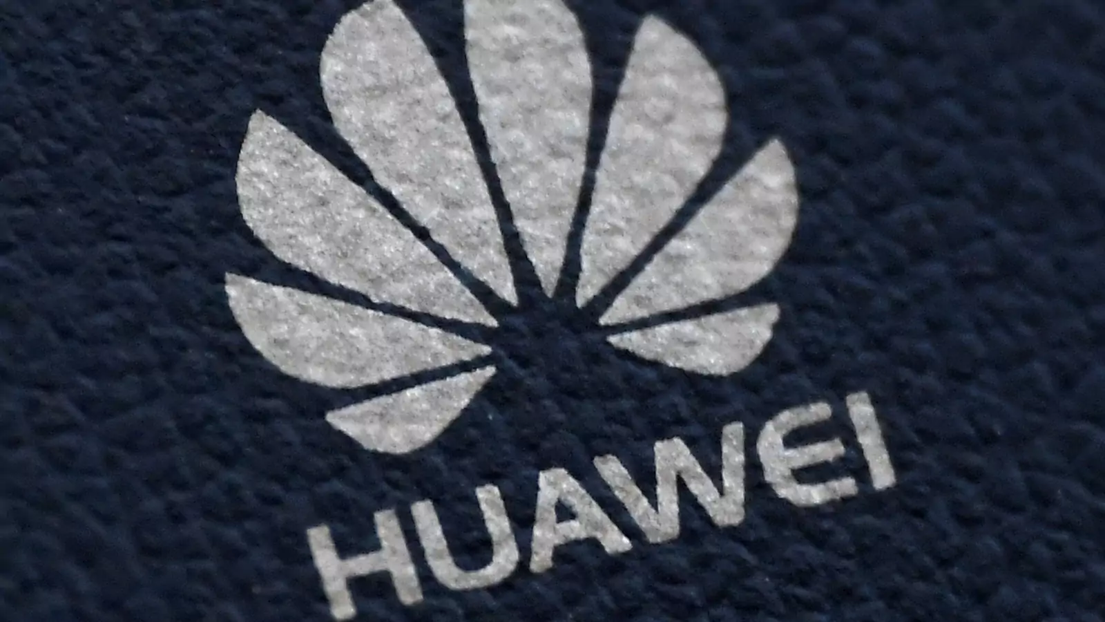 The Huawei logo is seen on a communications device.