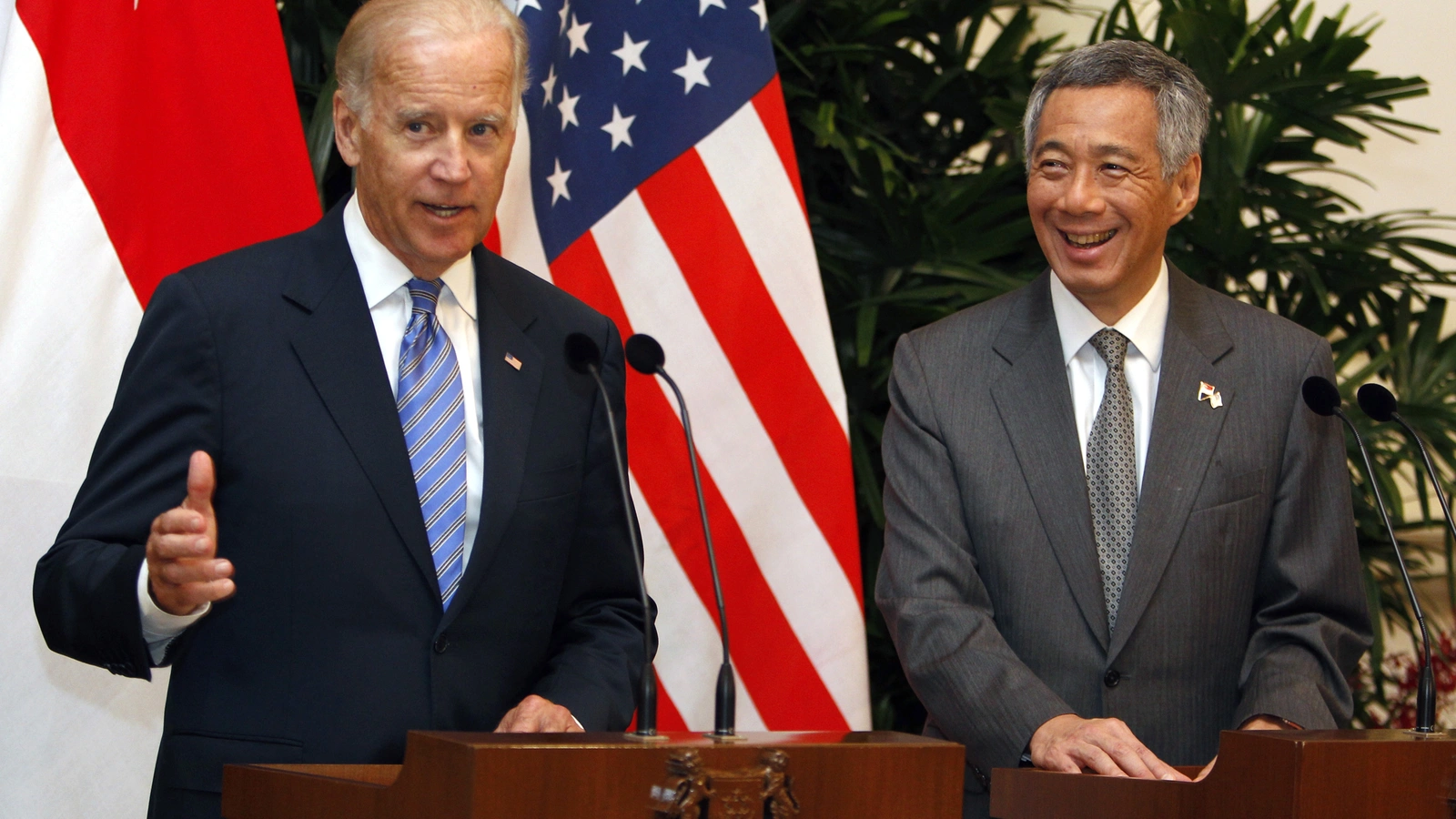 U.S. Vice President Joe Biden speaks to the press next to Singapore's Prime Minister Lee Hsien Loong (R) at the Istana presidential palace in Singapore on July 26, 2013.