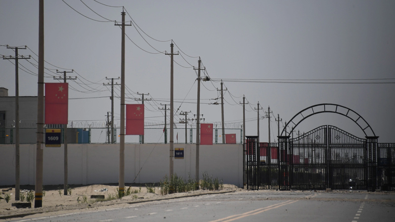 Chinese flags on a road leading to a facility in China’s northwestern Xinjiang region believed to be a reeducation camp where mostly Muslim ethnic minorities are detained. 