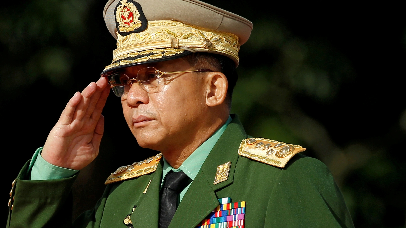 Myanmar Commander in Chief Senior General Min Aung Hlaing salutes as he attends an event marking the anniversary of Martyrs' Day at the Martyrs' Mausoleum in Yangon on July 19, 2016.