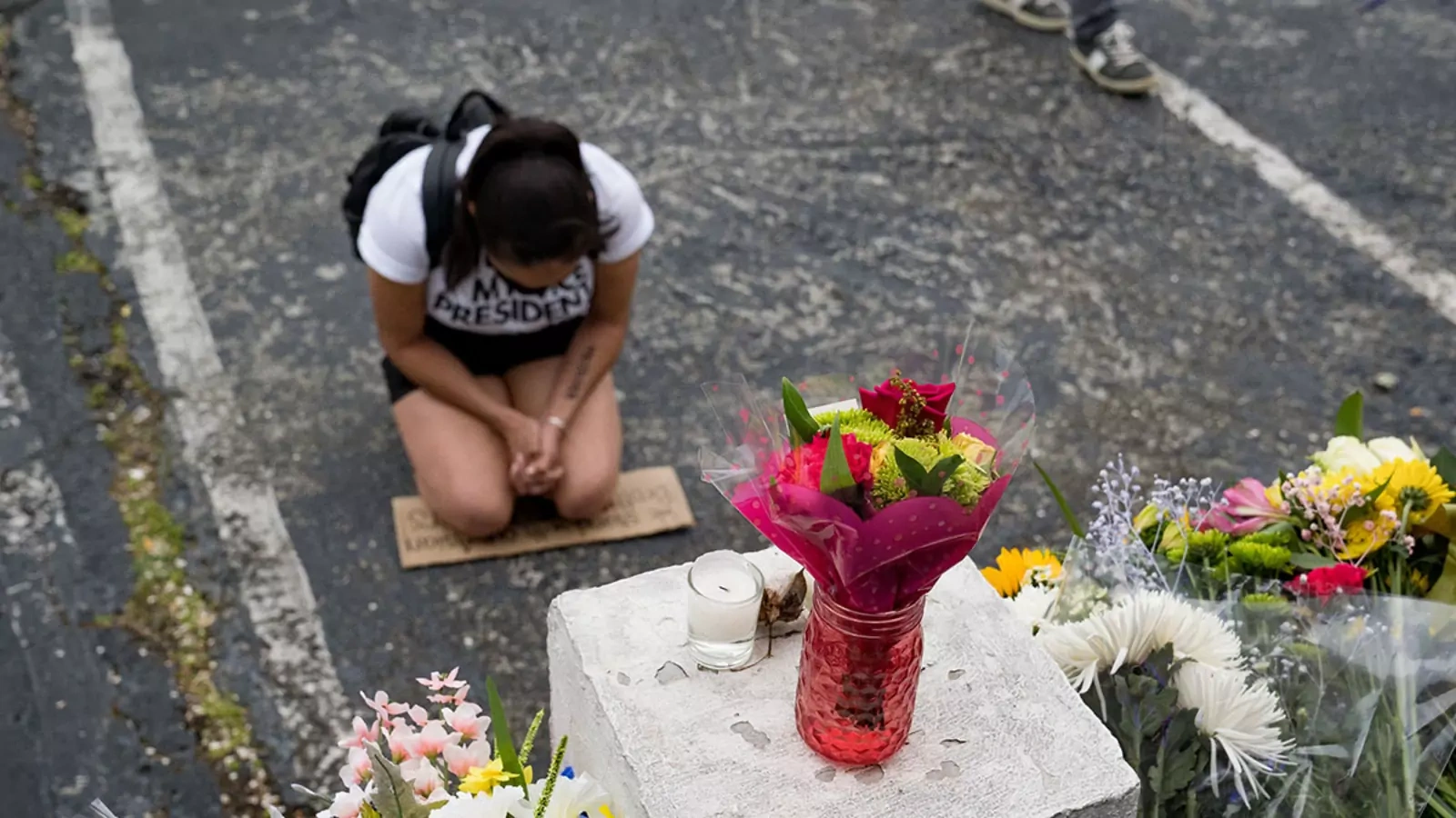  A demonstrator protesting violence against women and Asians kneels following the murder of three women in Atlanta in March 2021.