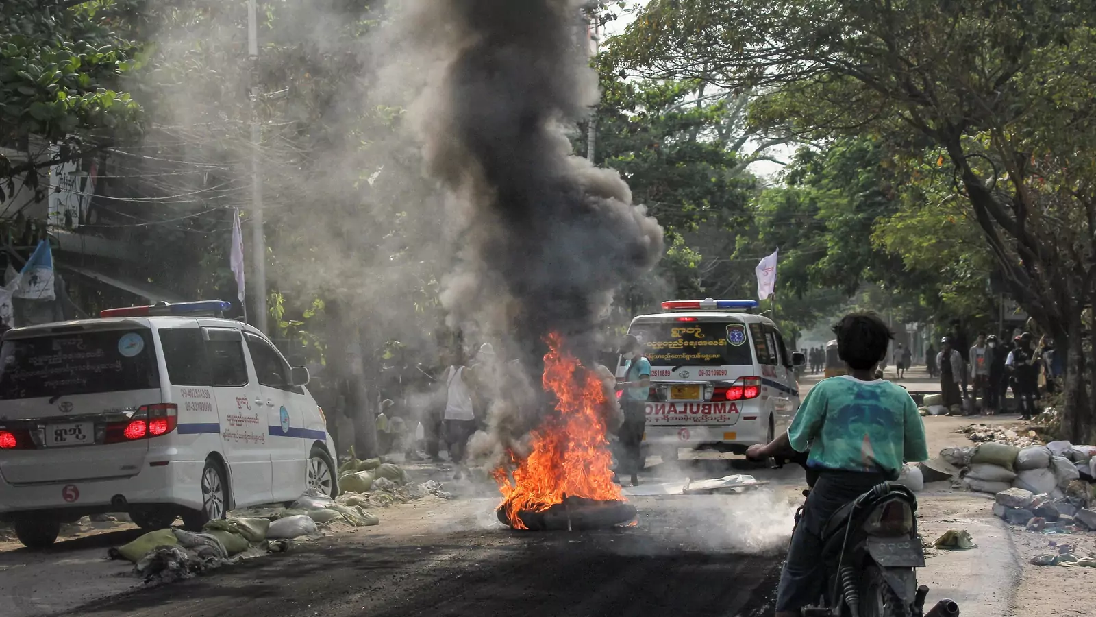 A fire burns on the street during a protest against the military coup, in Mandalay, Myanmar on April 1, 2021.