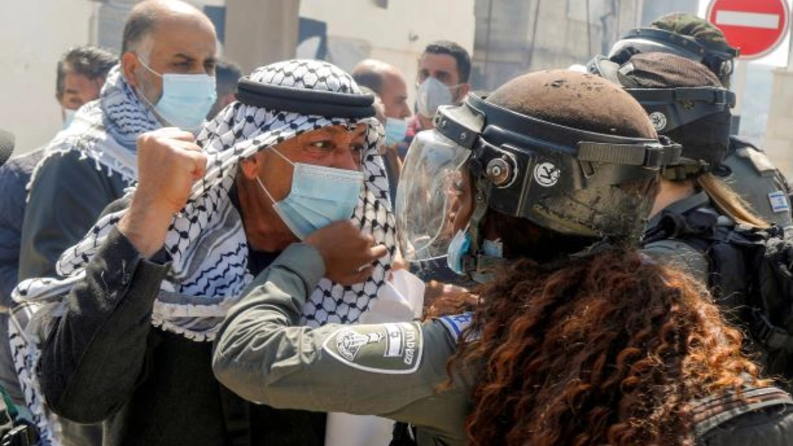 A Palestinian demonstrator scuffles with an Israeli border policewoman during a protest marking "Land Day", in Sebastia near Nablus, in the Israeli-occupied West Bank March 30, 2021.