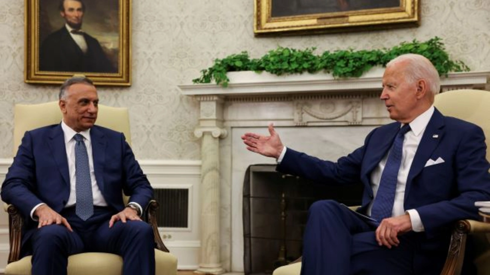 U.S. President Joe Biden Speaks with Iraq's Prime Minister Mustafa Al-Kadhimi during a bilateral meeting in the Oval Office at the White House in Washington, U.S., July 26, 2021. 