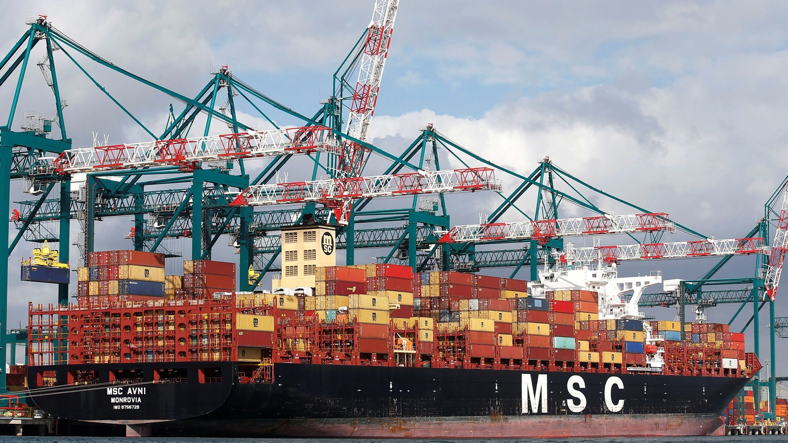 A container ship docked alongside cranes at the Chilean port of San Antonio