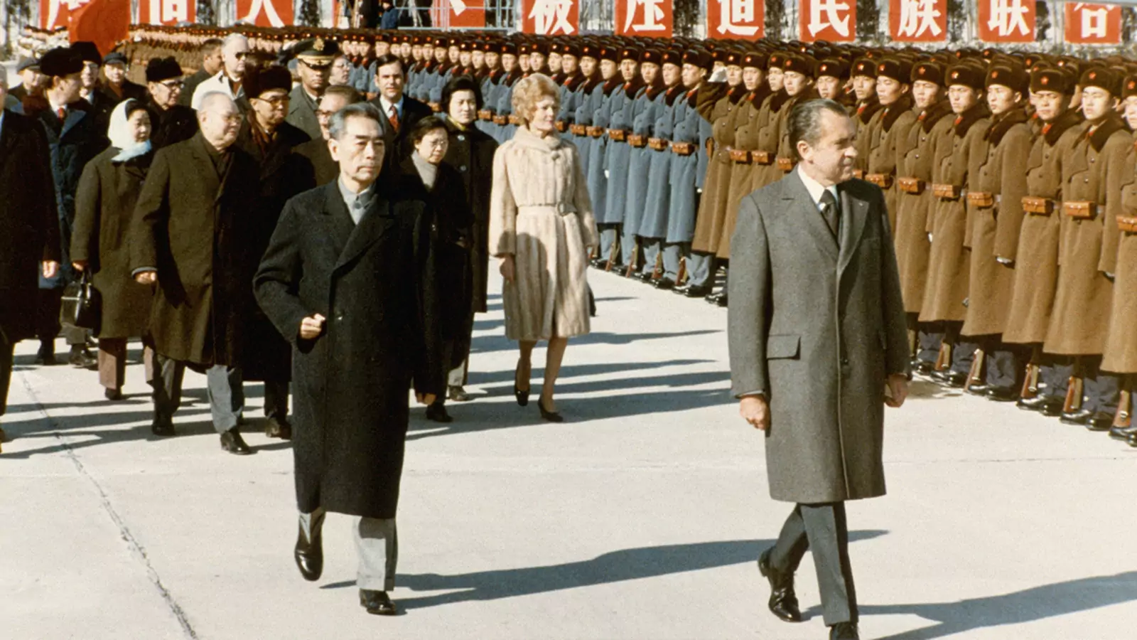 President Nixon inspects assembled Chinese soldiers with Premier Zhou Enlai.