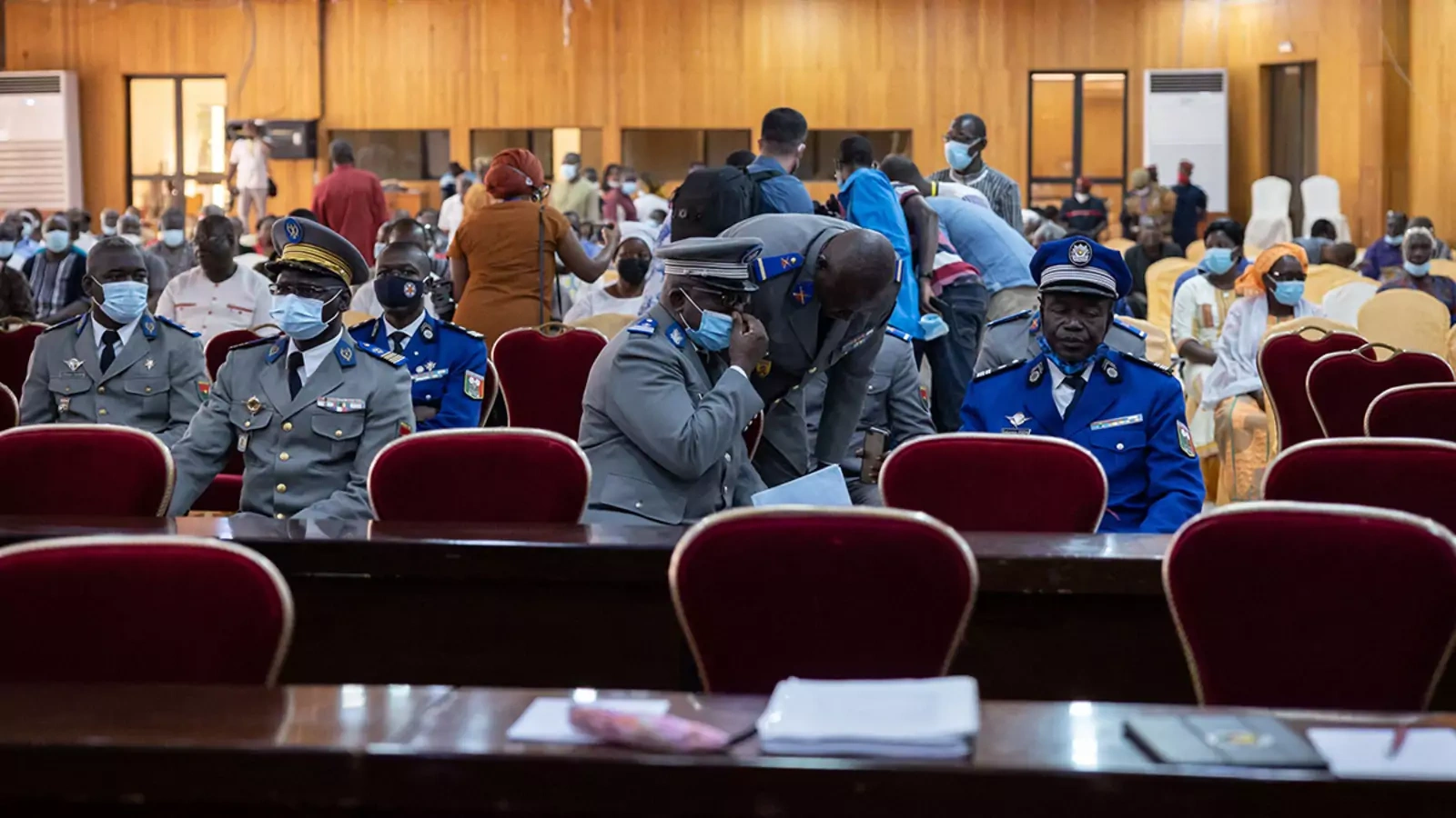 People attend the opening of the trial against alleged perpetrators of the assassination of former President Thomas Sankara in Ouagadougou, Burkina Faso.