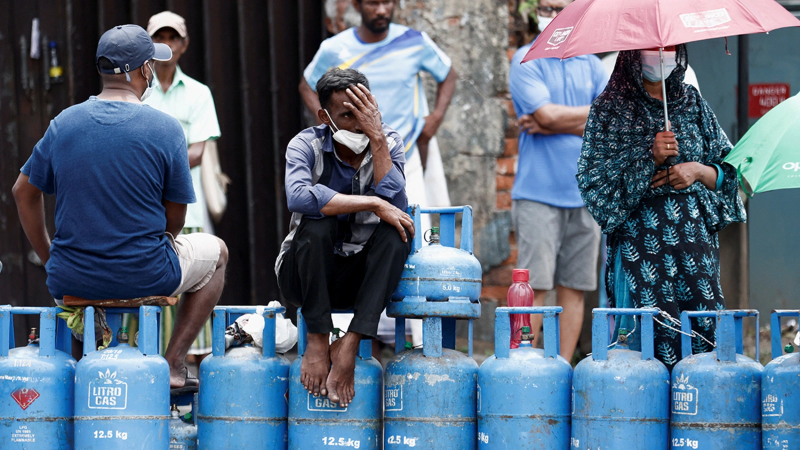 People block a main road as they wait for gas trucks to arrive in Colombo, Sri Lanka.