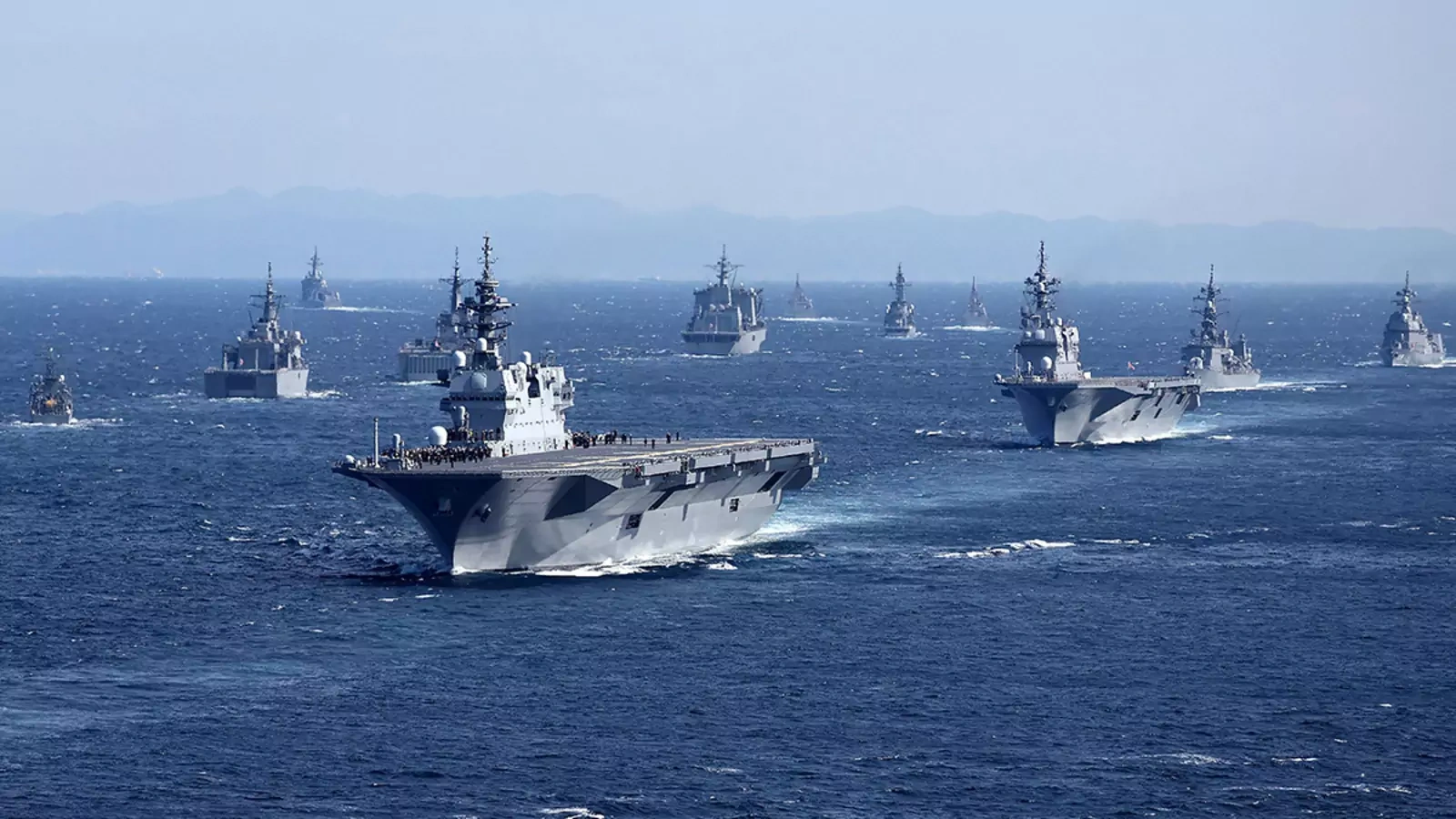 Military vessels from Japan and other countries sail in Sagami Bay during the International Fleet Review, held by Japan’s Maritime Self-Defense Force.