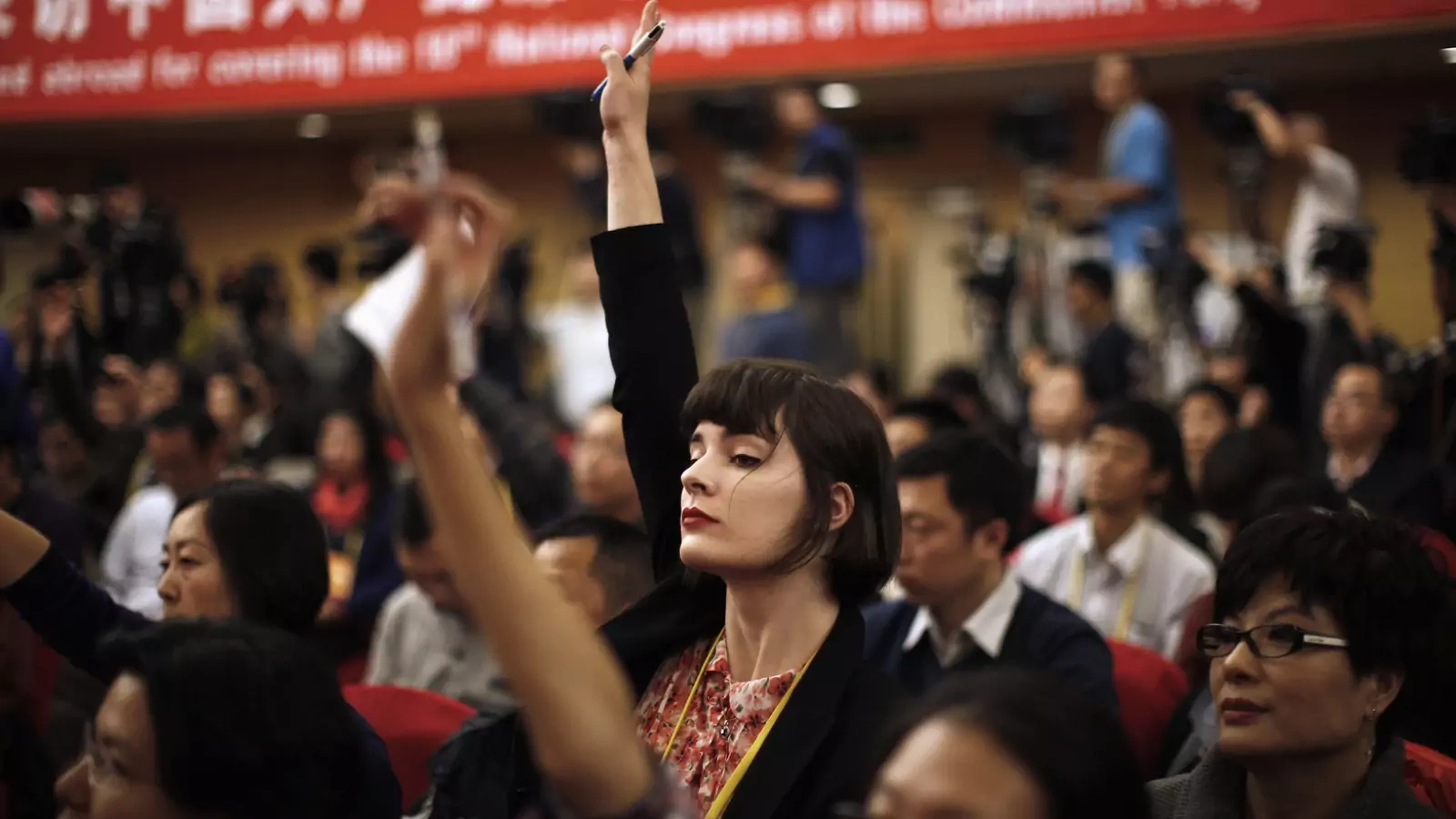 A journalist from Global CAMG Media Group asks a question during a news conference in Beijing on November 12, 2012. Melbourne-based Global CAMG Media Group is majority owned by China Radio International, the country’s state run radio network.