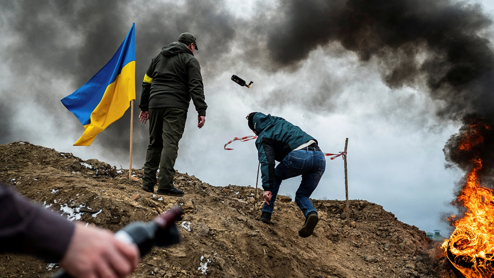 A civilian in Zhytomyr, Ukraine trains to throw Molotov cocktails to defend the city after Russia's invasion of Ukraine in March, 2022. 