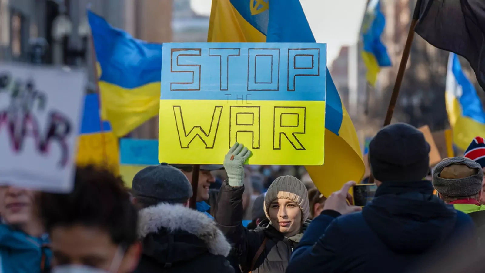 A demonstrator holds a sign during a peaceful stand for Ukraine rally in Boston in February 2022.