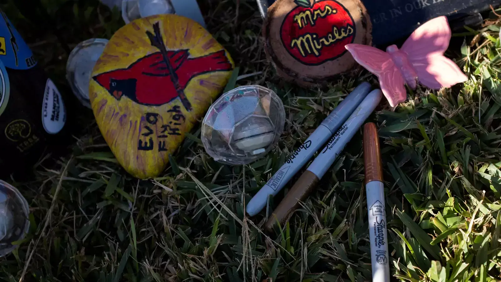Sharpie markers are seen on the grave of Eva Mireles, one of the victims of the Robb Elementary mass shooting that resulted in the death of 19 children and two teachers in the U.S. school shooting, in Uvalde, Texas, United States, November 30, 2022.