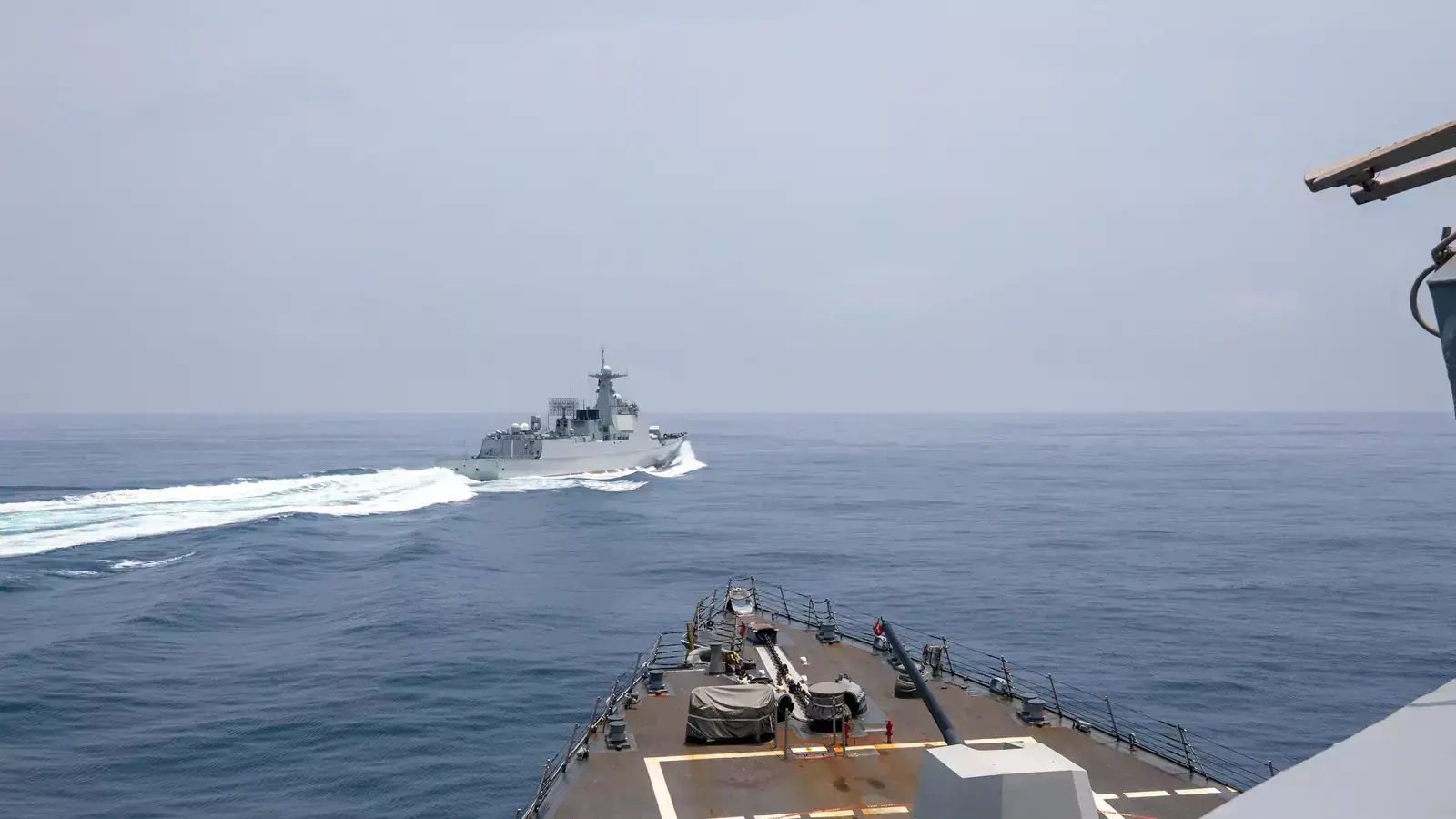 Chinese warship Luyang III sails past U.S. destroyer USS Chung-Hoon in the Taiwan Strait on June 3, 2023.