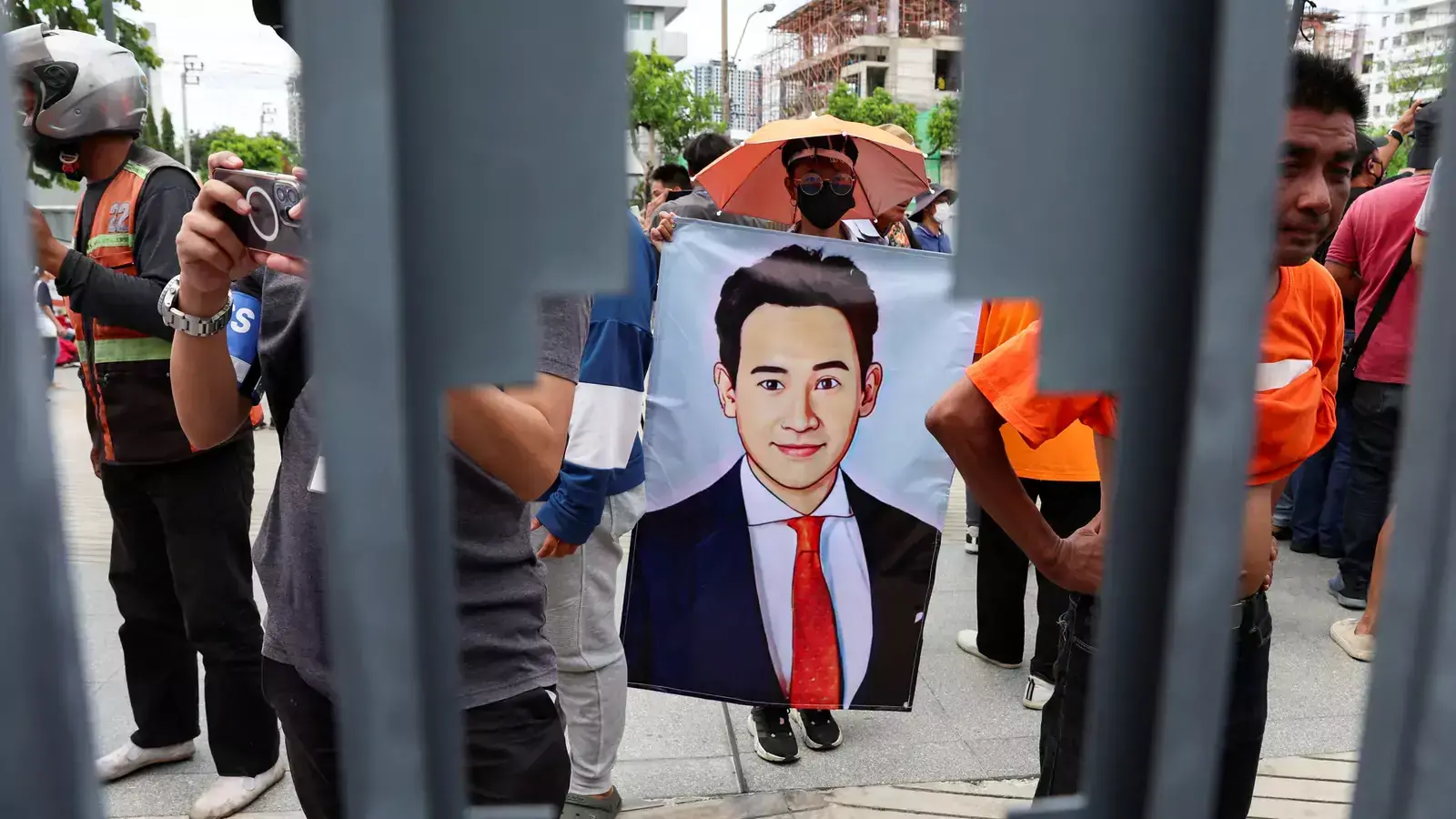 A supporter of Move Forward Party Leader Pita Limjaroenrat holds a banner with his picture on the day of the second vote for a new prime minister, at the parliament in Bangkok, Thailand, on July 19, 2023.
