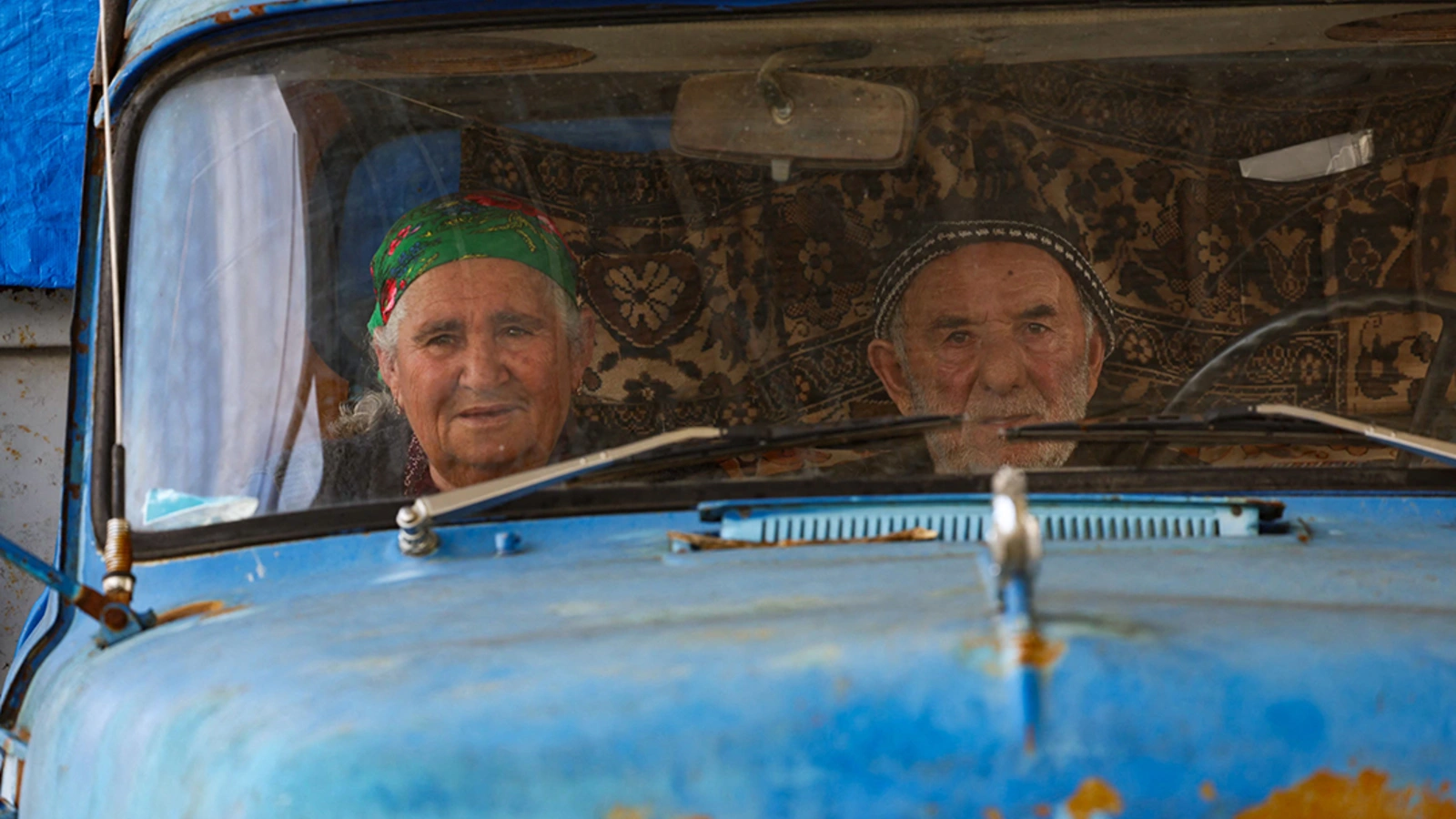 Refugees wait to cross the border at a checkpoint on the so-called Lachin Corridor between Nagorno-Karabakh and Armenia on September 26, 2023.