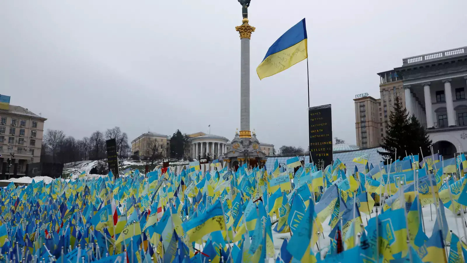 Flags representing fallen soldiers are seen in the snow on Independence Square, as Russia's attack on Ukraine continues, in Kyiv, Ukraine on December 22, 2022.