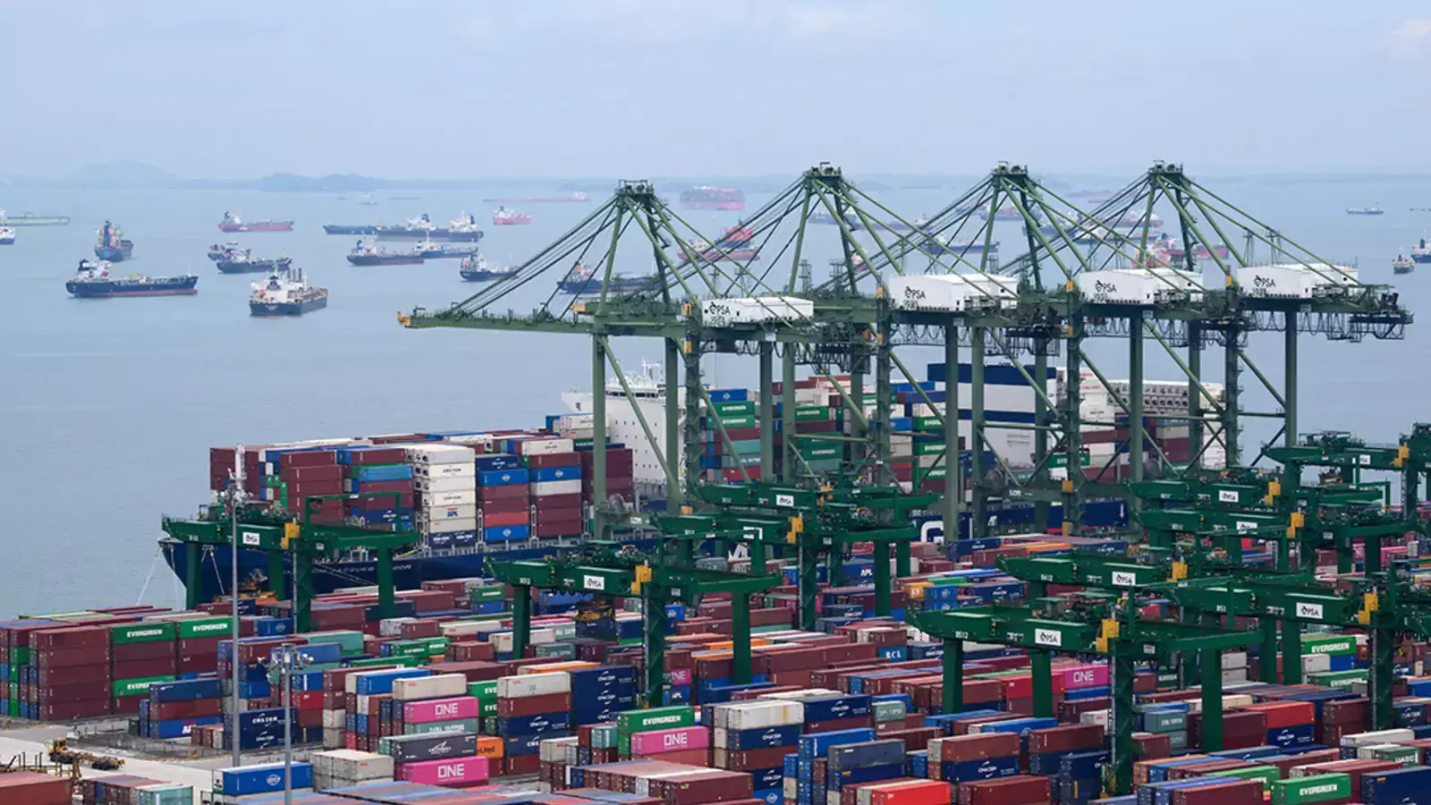 Containers are loaded at the Port of Singapore, the second largest port in the world.