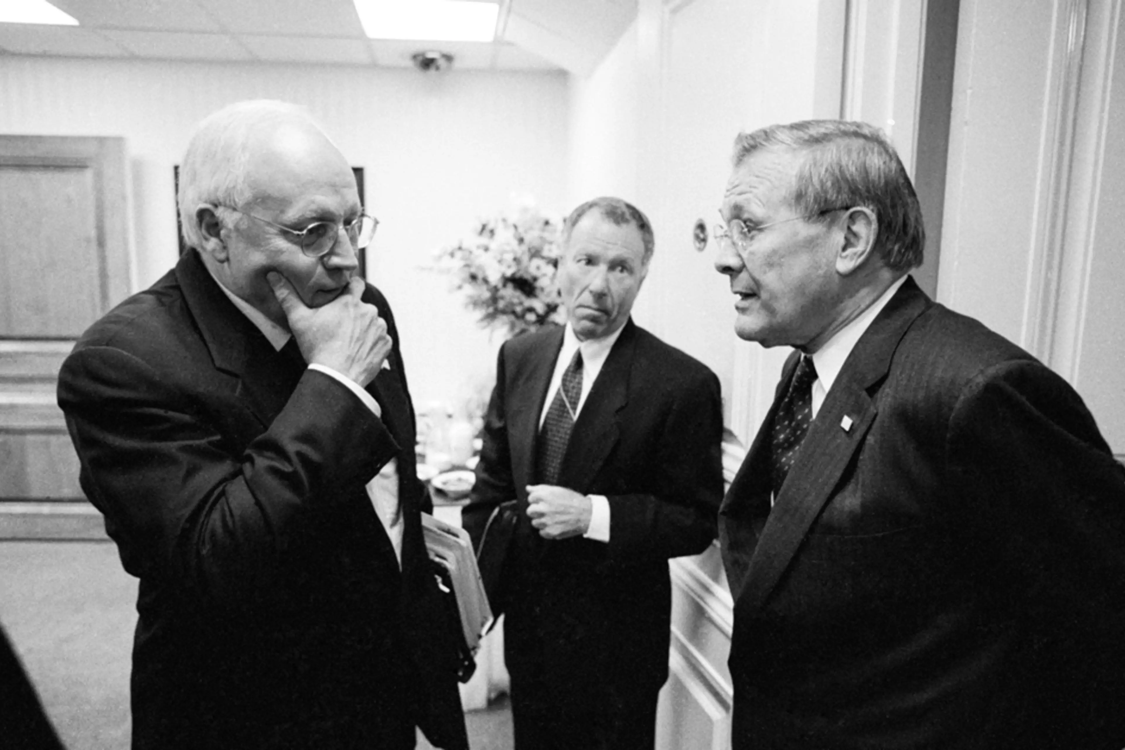 Vice President Dick Cheney and Defense Secretary Donald Rumsfeld talk at the Pentagon in 2002.