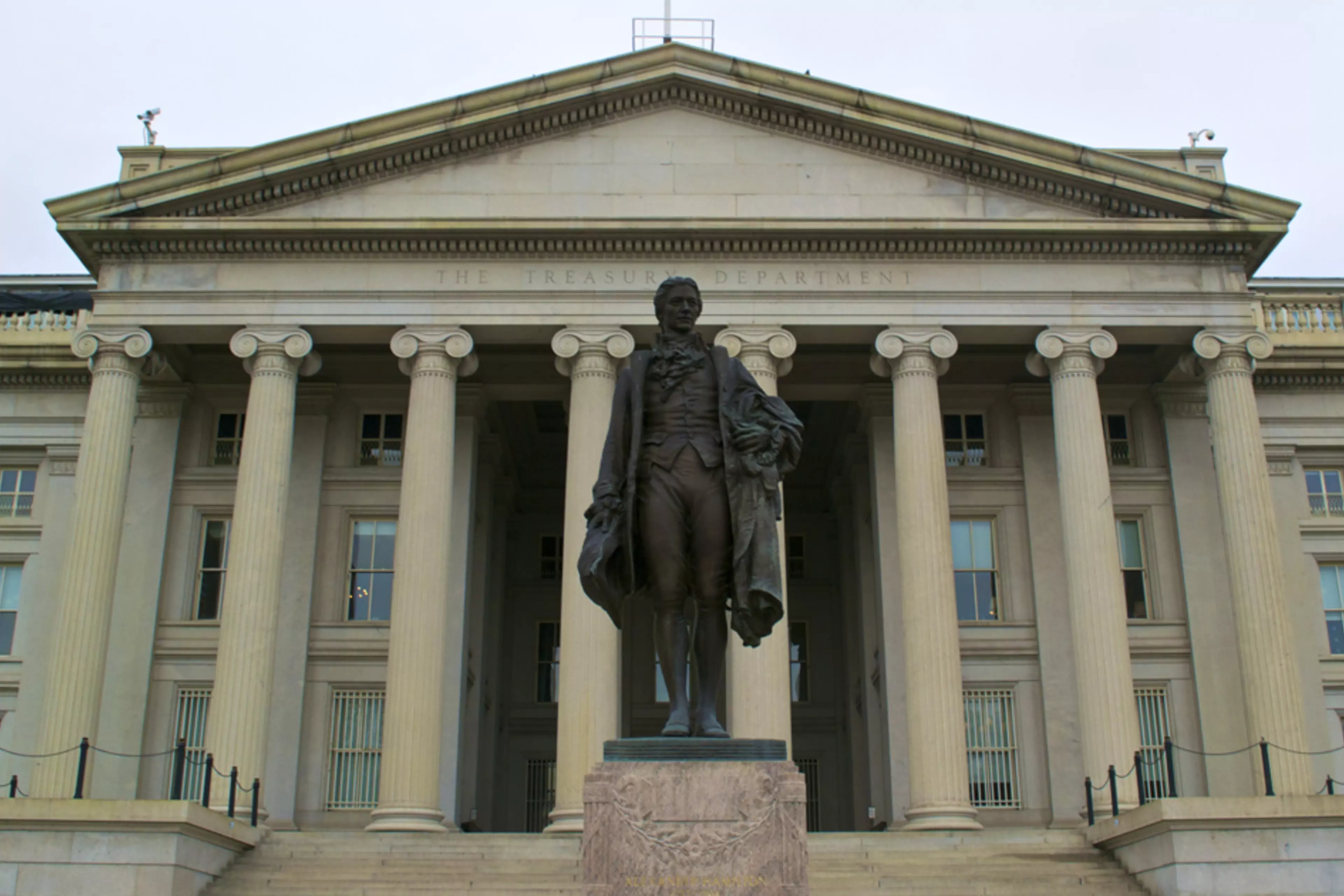 A statue of Alexander Hamilton in front of the U.S. Treasury Department headquarters in Washington, DC.