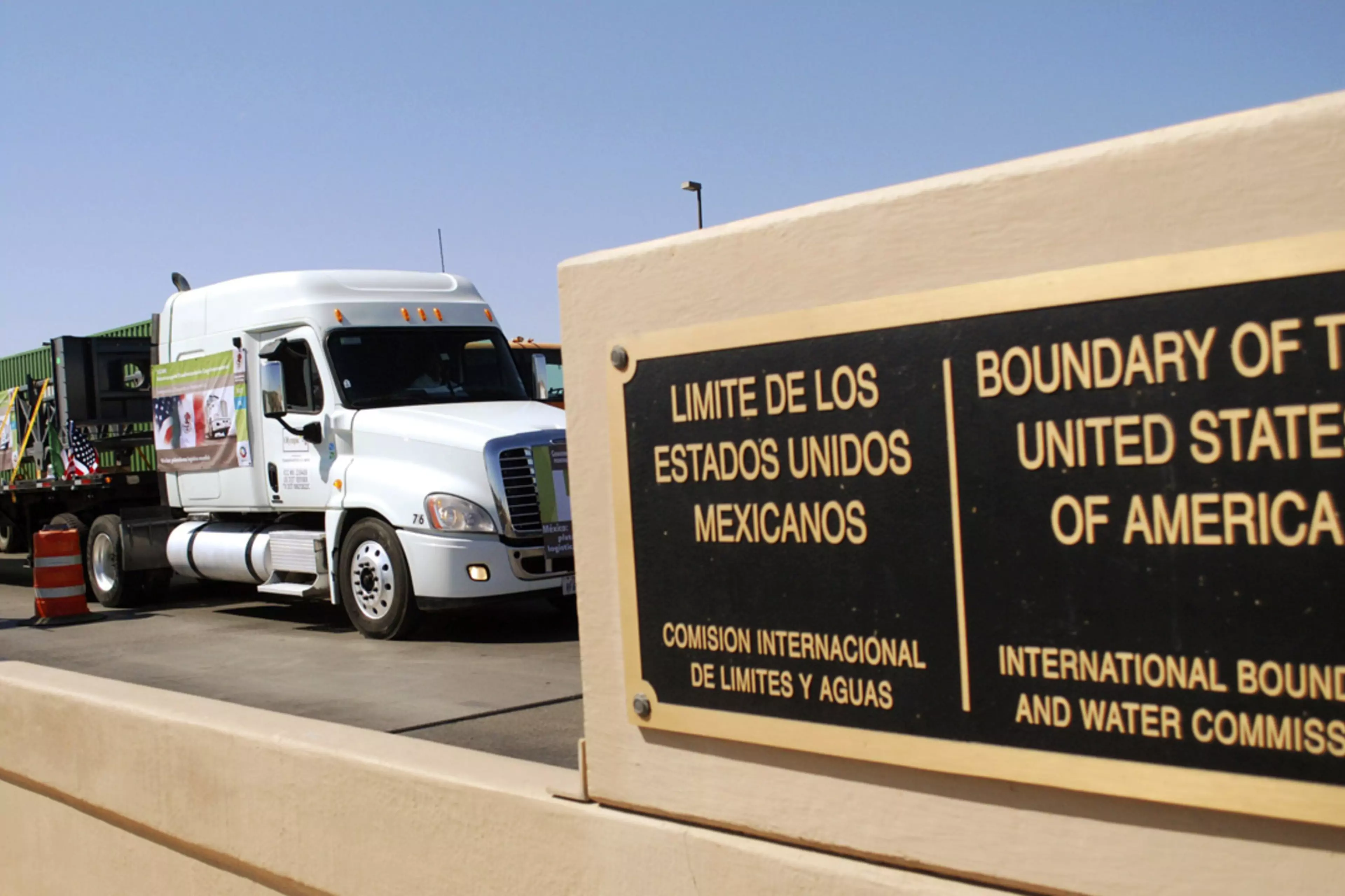 Mexican commercial trucks cross the border into the United States at Laredo, Texas.