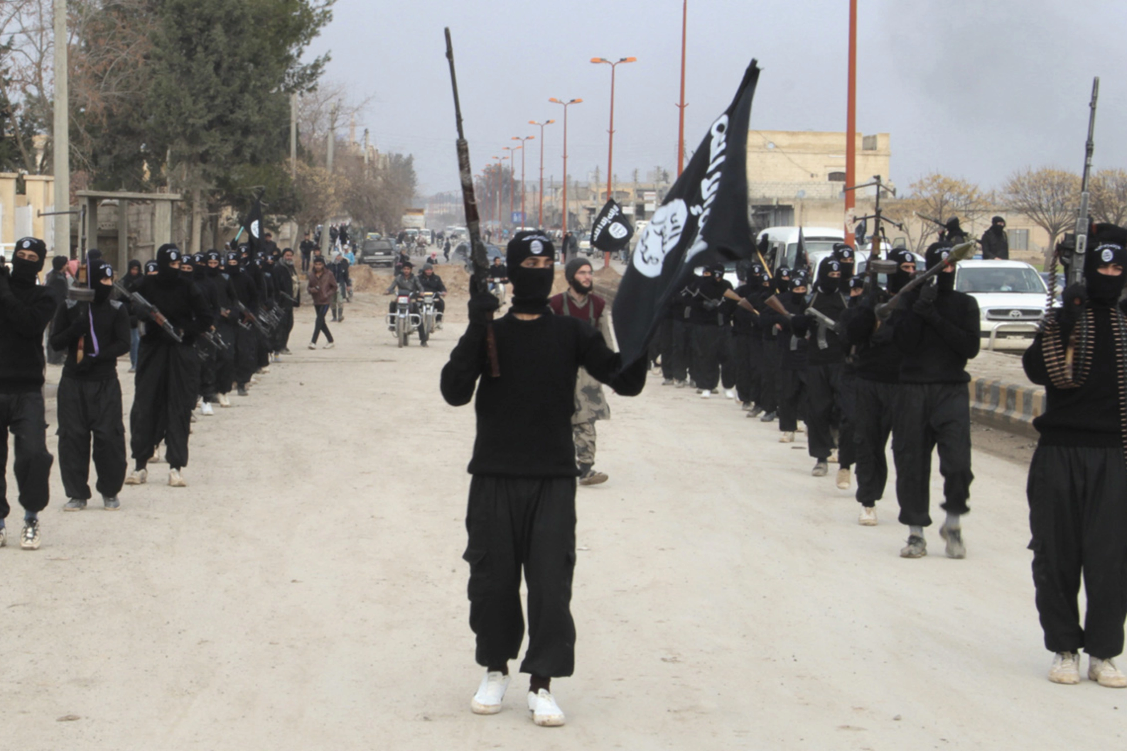 Islamic State militants parade in Tel Abyad, near Syria’s border with Turkey.