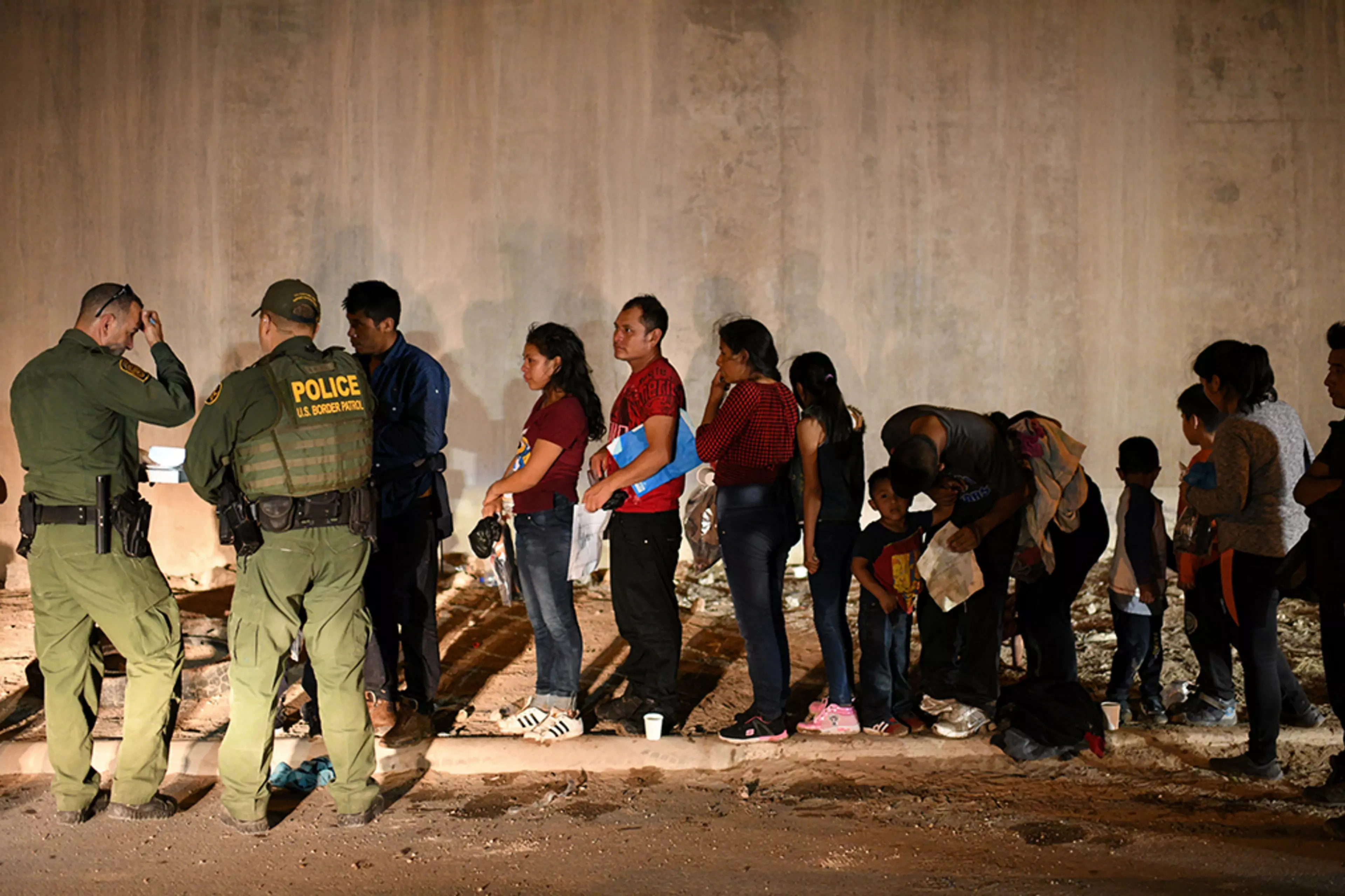 Migrants wait in line to seek asylum after illegally entering the United States in Hidalgo, Texas.