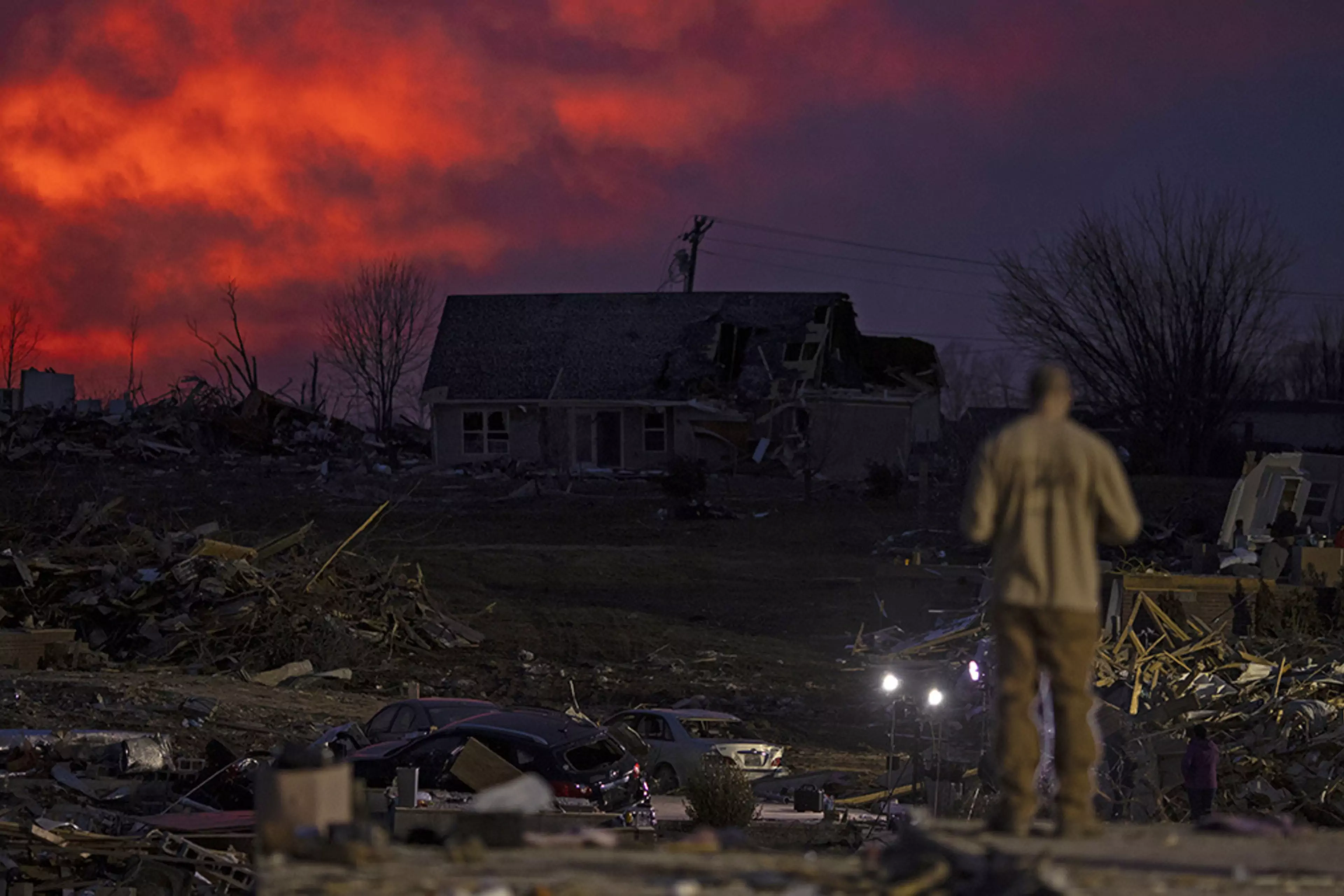The sun sets behind damaged homes after a tornado in Cookeville, Tennessee, in March 2020. 