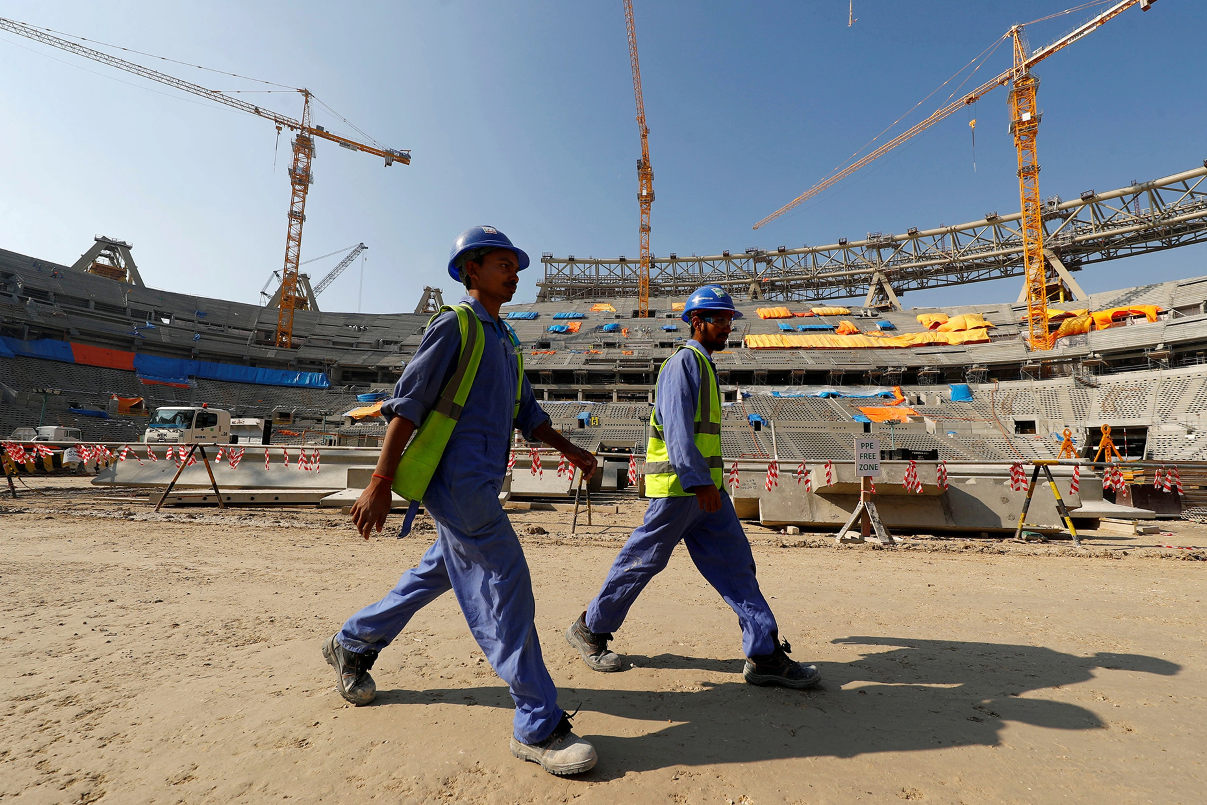 Workers construct the Lusail National Stadium for the 2022 FIFA World Cup in Doha, Qatar.