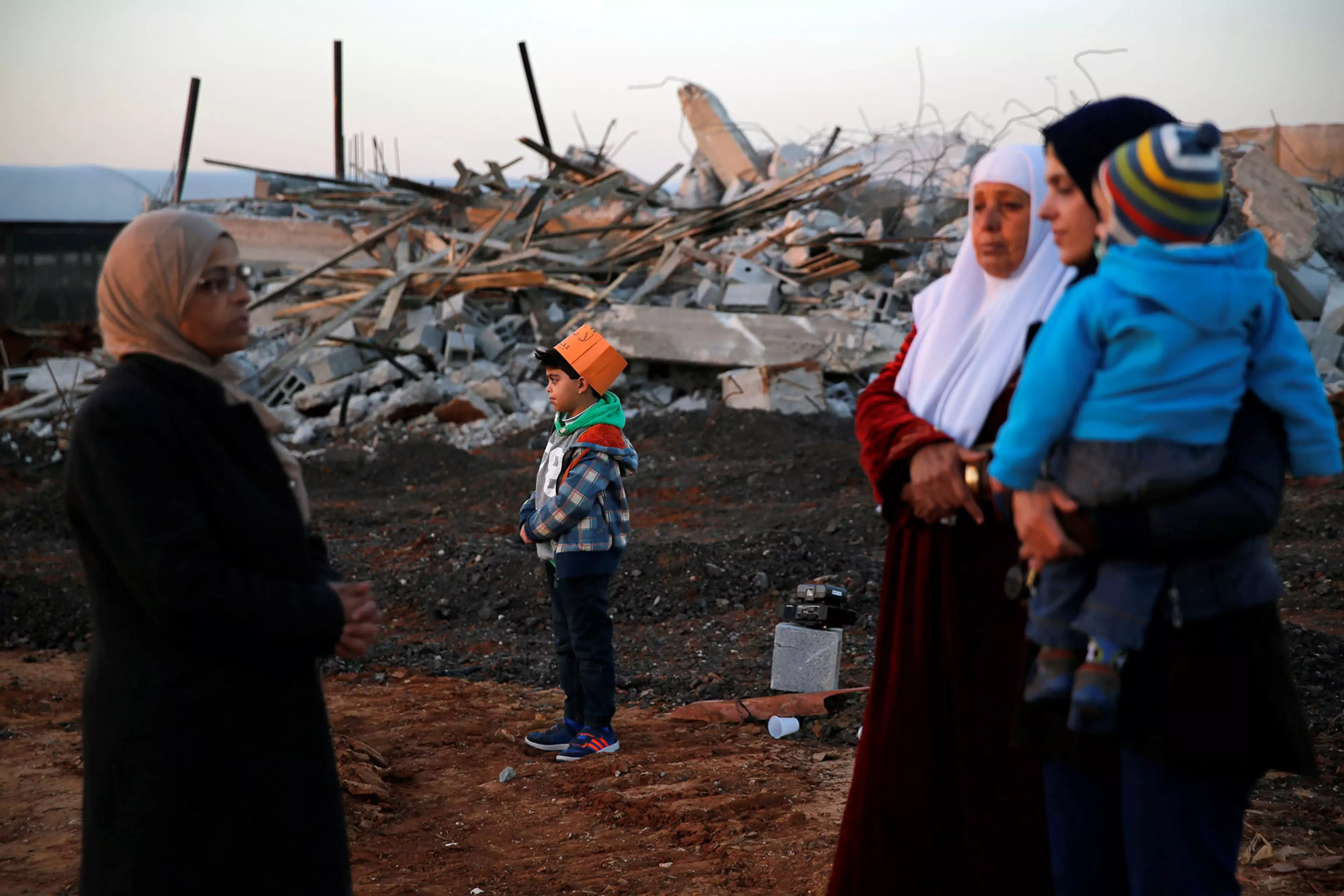 Arab citizens of Israel stand near demolished houses in the northern city of Qalansawe.