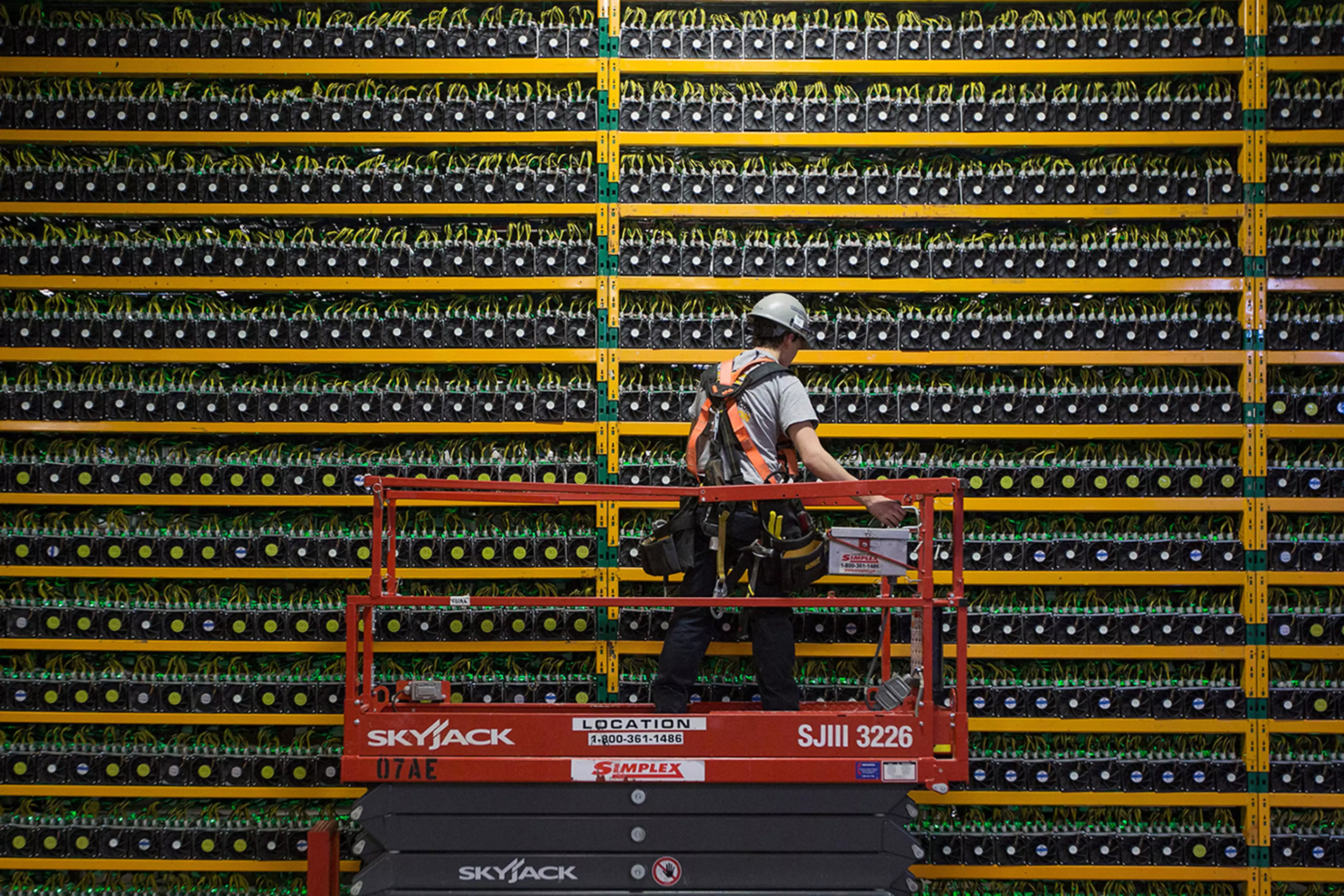 A technician inspects a Bitcoin mining operation in Quebec, Canada.