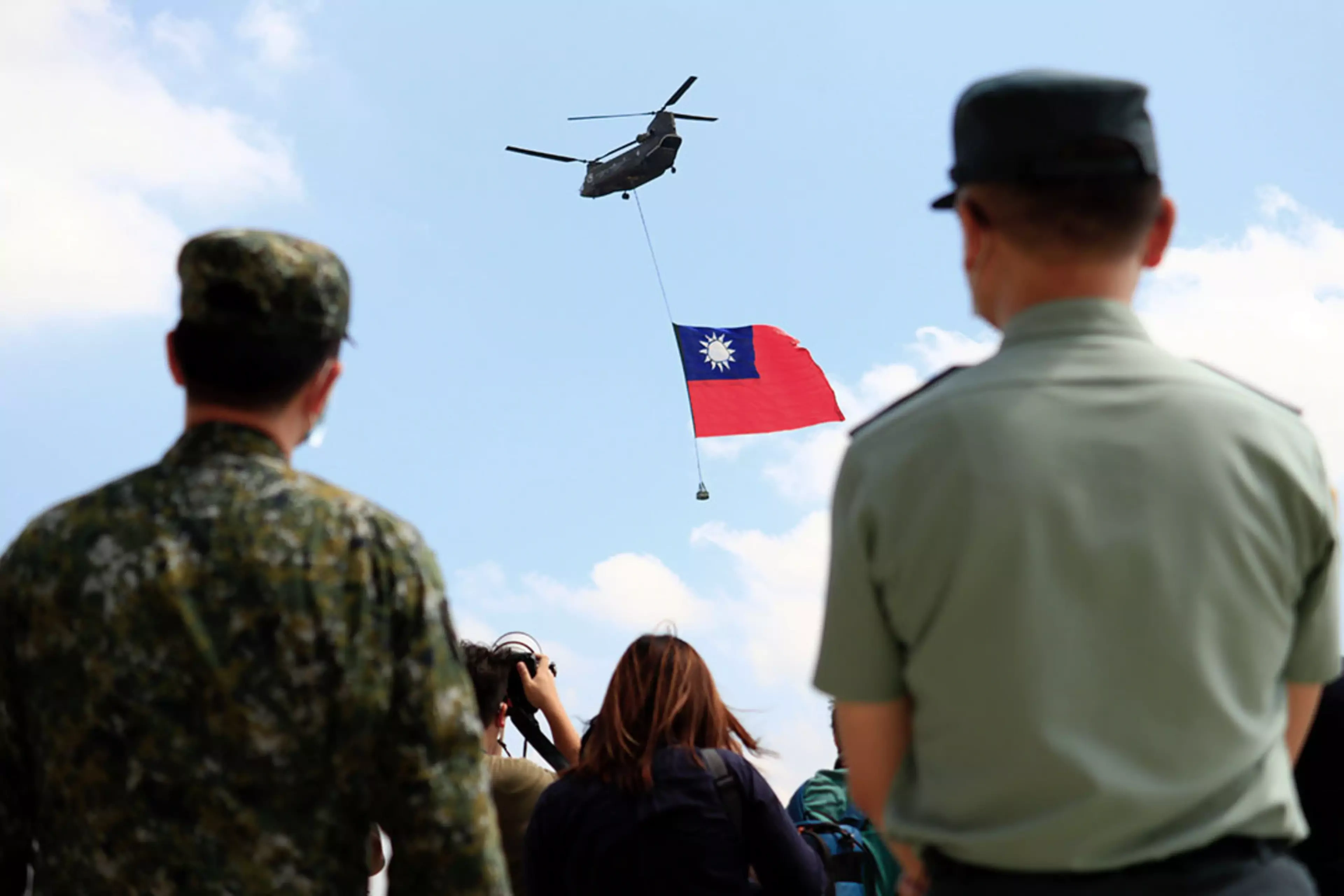 A helicopter flies a Taiwanese flag in Taoyuan, Taiwan.