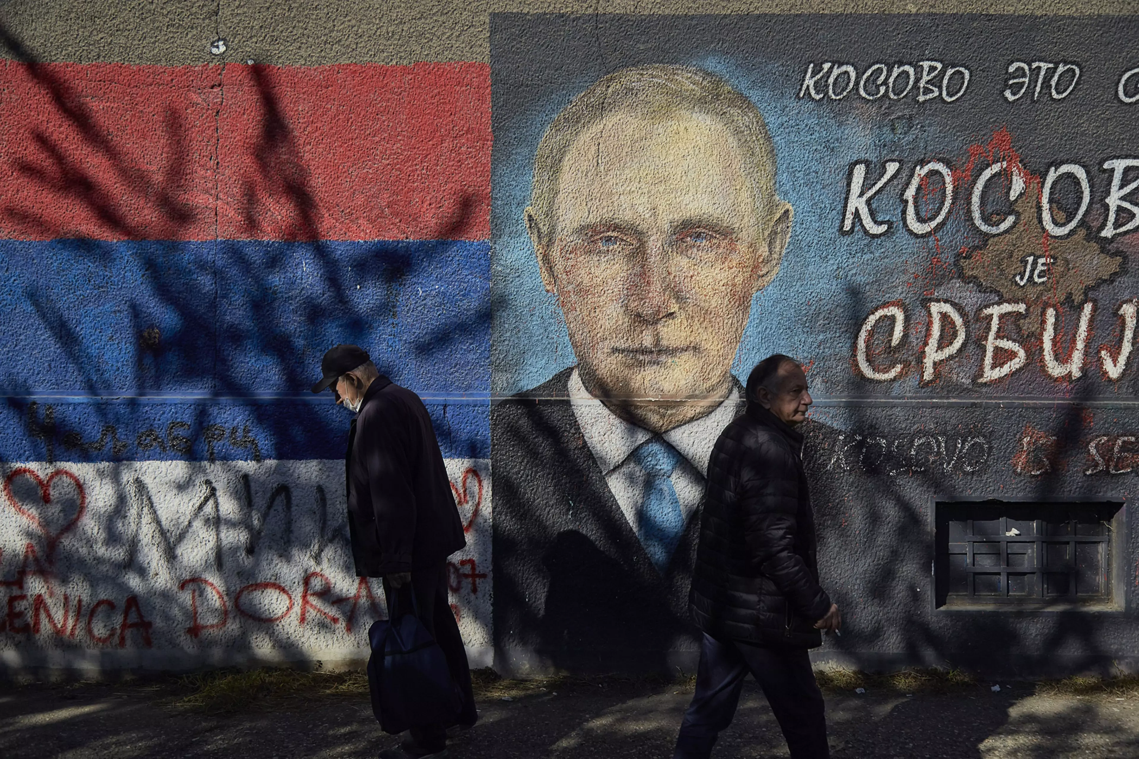 A mural in Belgrade depicts Russian President Vladimir Putin and a text reading “Kosovo is Serbia.”