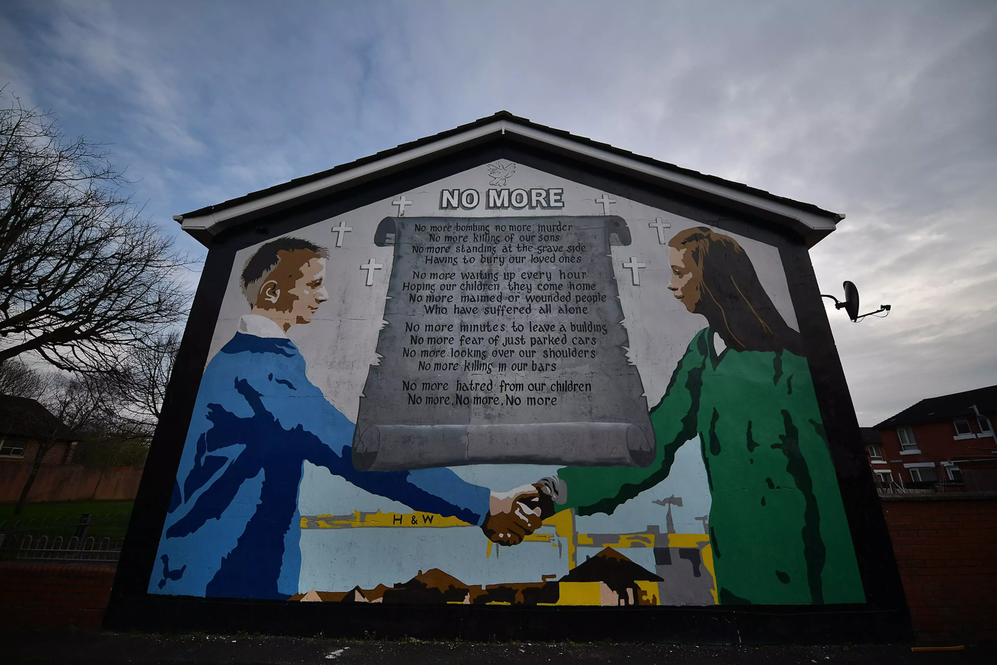 A peace mural adorns a building in a loyalist neighborhood of Belfast.